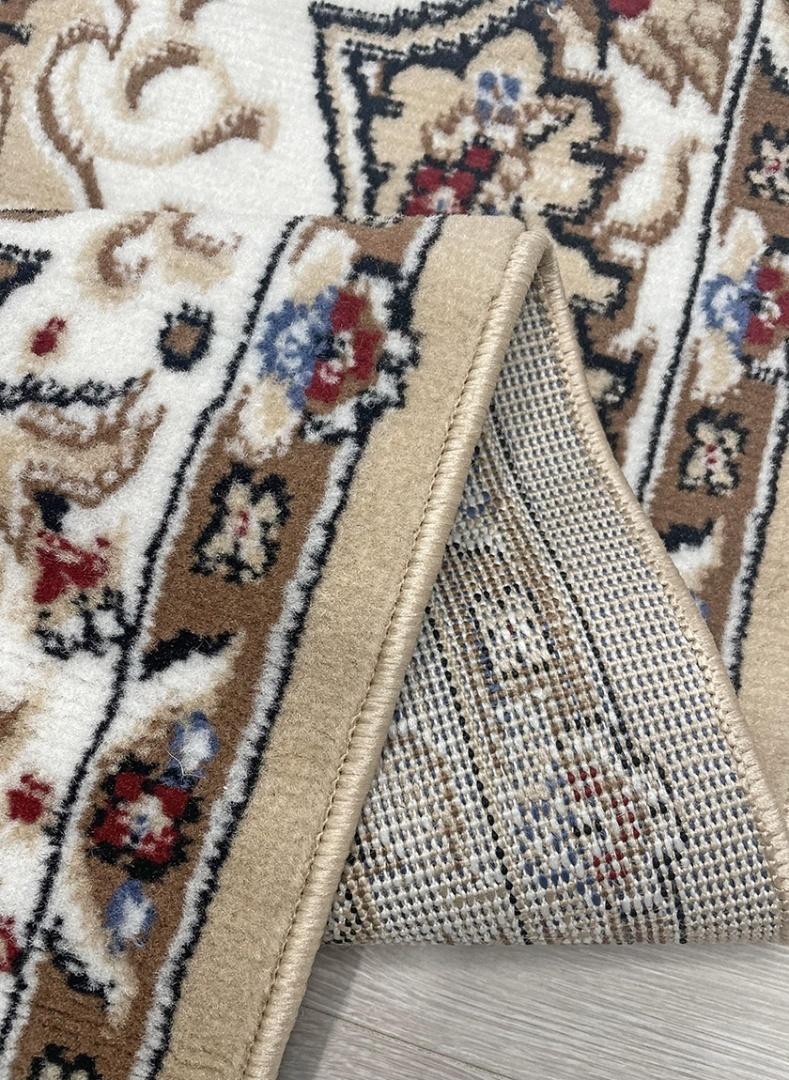 This elegant contemporary Kazakh rug features a classic Tabriz design, blending traditional charm with modern durability. Machine-made from high-quality polypropylene, this lightweight rug comes in a refined white and beige color