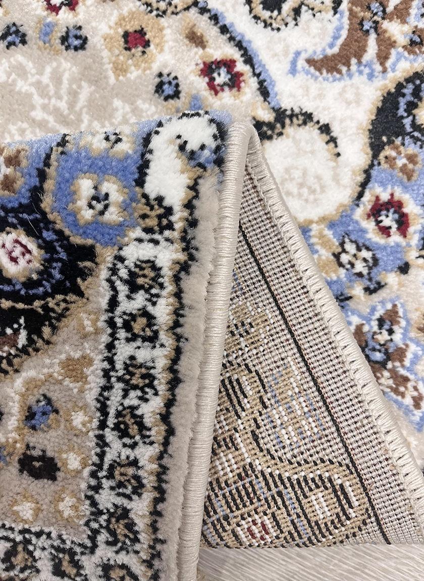 This elegant contemporary rug from Kazakhstan features a Tabriz style neoclassical pattern and is machine-made from high-quality polypropylene. The soft beige color adds a touch of sophistication to any room, making it a versatile and stylish