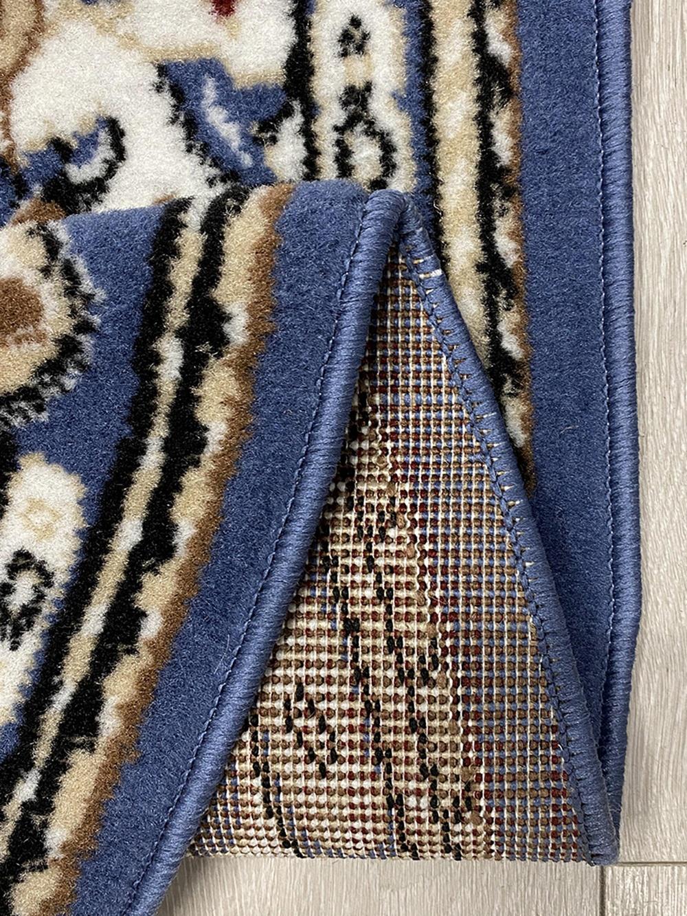 This contemporary Kazakh rug features a classic Tabriz design with an elegant oval shape. Machine-made from durable polypropylene, this lightweight rug comes in a striking shade of blue.

Features:

Type: Rug
Shape: Oval
Material: