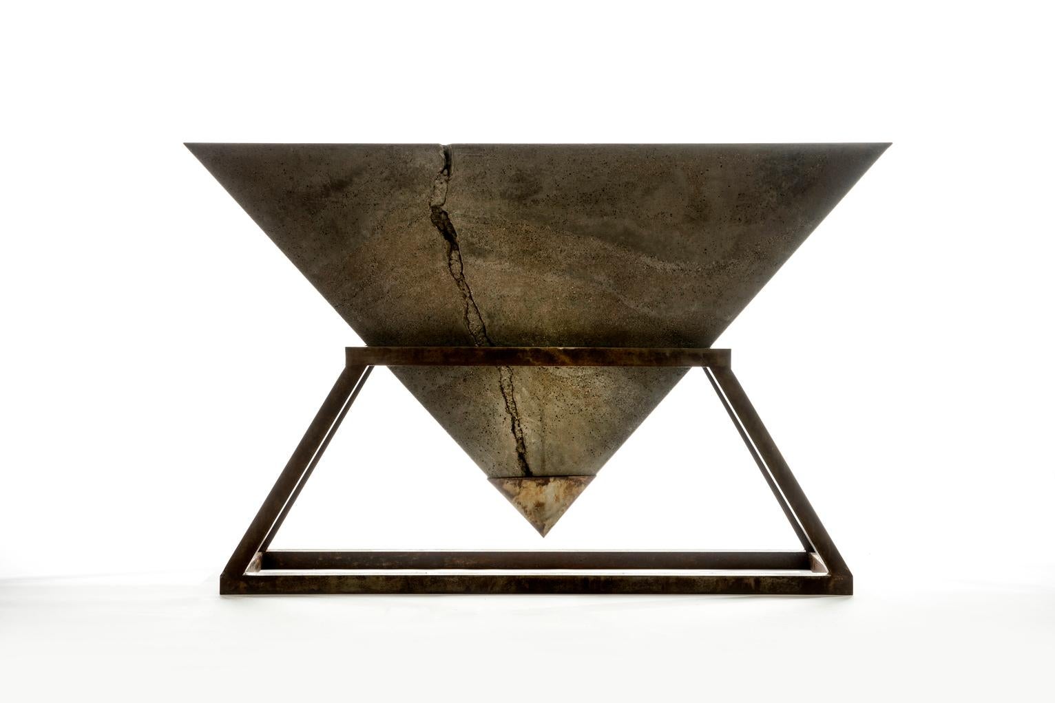 Kheops Console is a concrete and aluminium console table designed by Harow Studio.