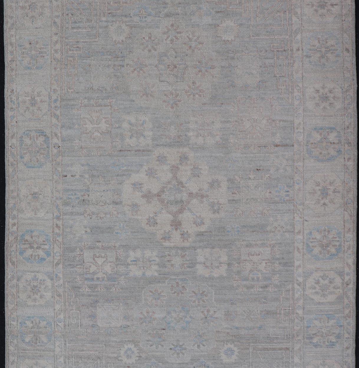 Hand-Knotted Contemporary Khotan with Circular Medallions in Light Colors For Sale