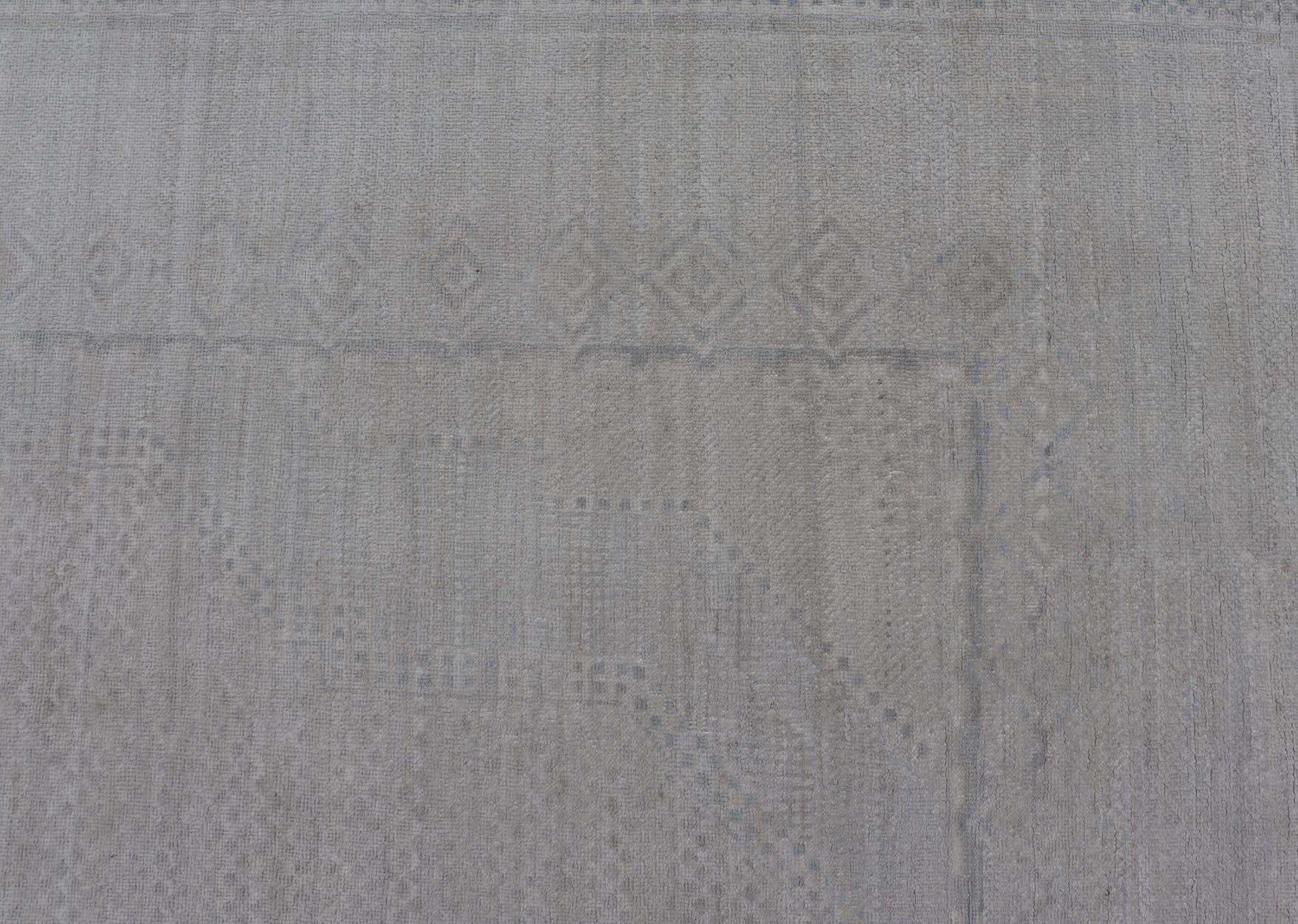 Wool Contemporary Khotan with Medallions in Light Colors With All-Over Tribal Motifs For Sale