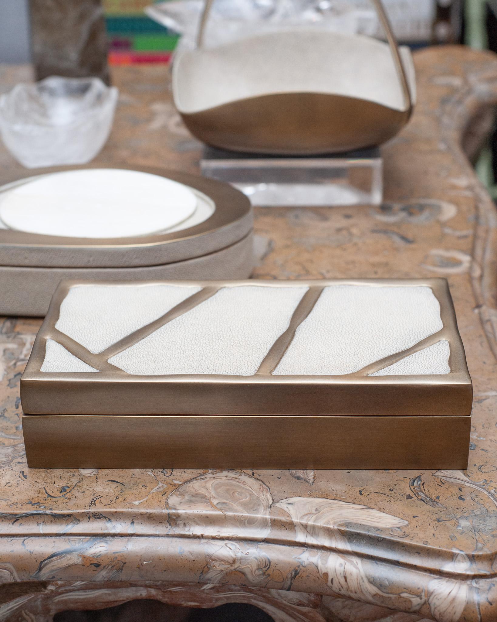 In stock now - A gorgeous Kifu Paris decorative box in brass over a base of walnut, with creme shagreen inlay lid. Expertly crafted, this decorative box is a perfect accessory for any table and is as beautiful as it is functional. 