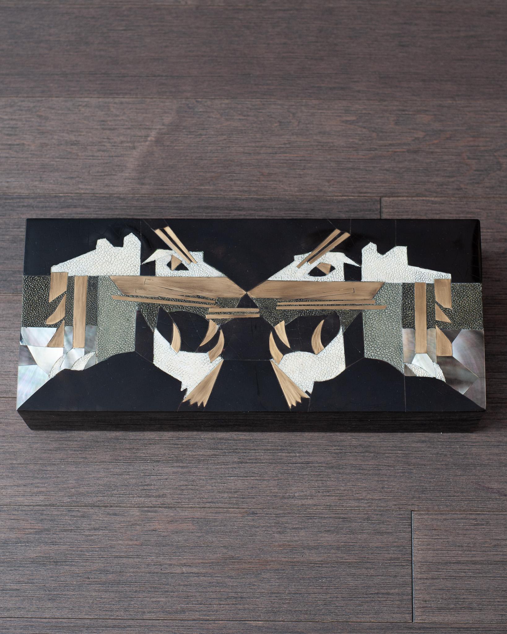In stock now - A gorgeous Kifu Paris decorative box in black penshell over a base of walnut, with brass, creme & grey shagreen, and black mother of pearl inlay lid. Expertly crafted in a double panther motif, this decorative box is a perfect