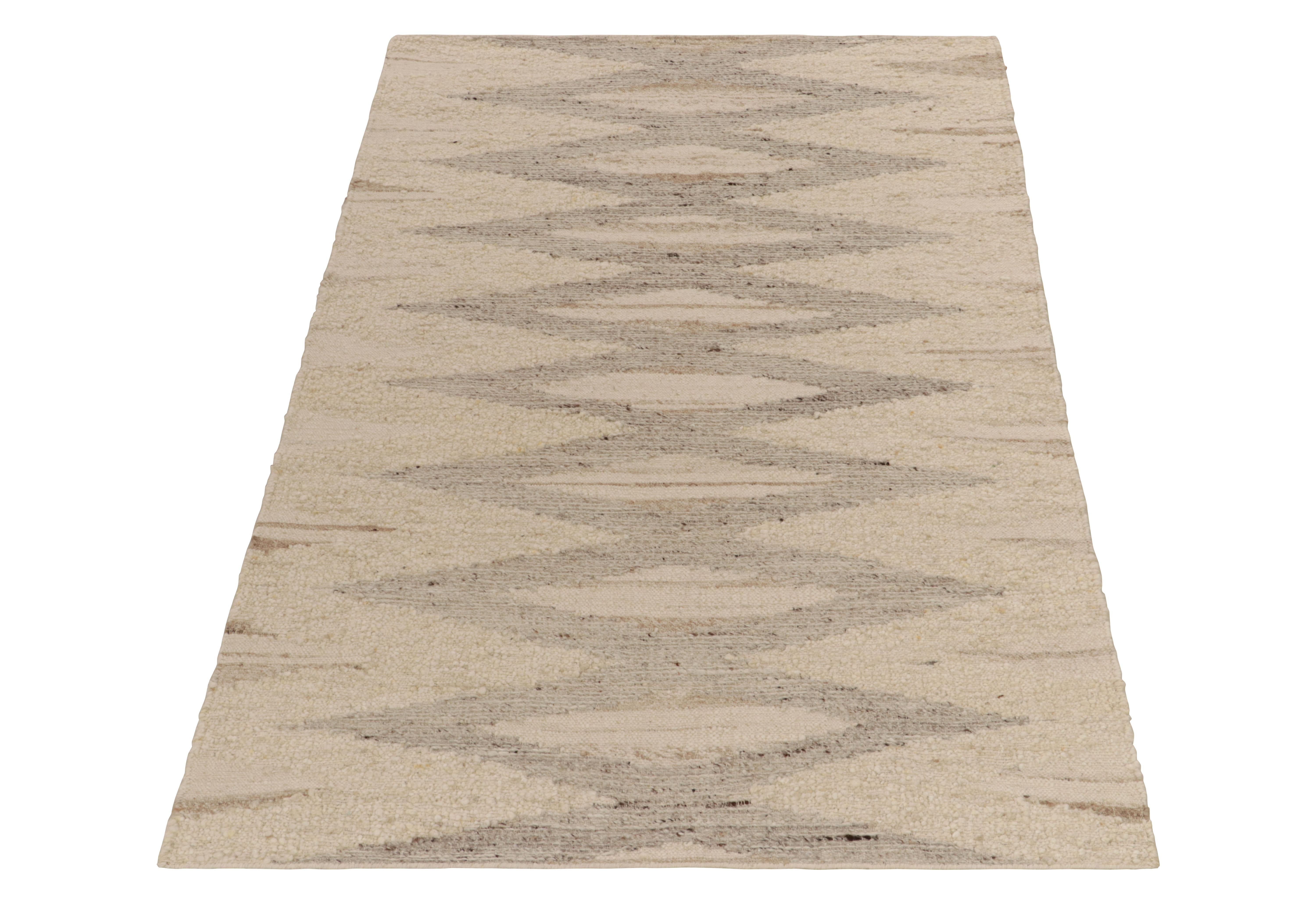 Rug & Kilim presents a bold contemporary take on Deco styles and flat weave aesthetics with this 5x8 handspun piece. The Kilim rug features a modern geometric pattern in a comforting beige brown colorway for an exceptional sense of movement in a