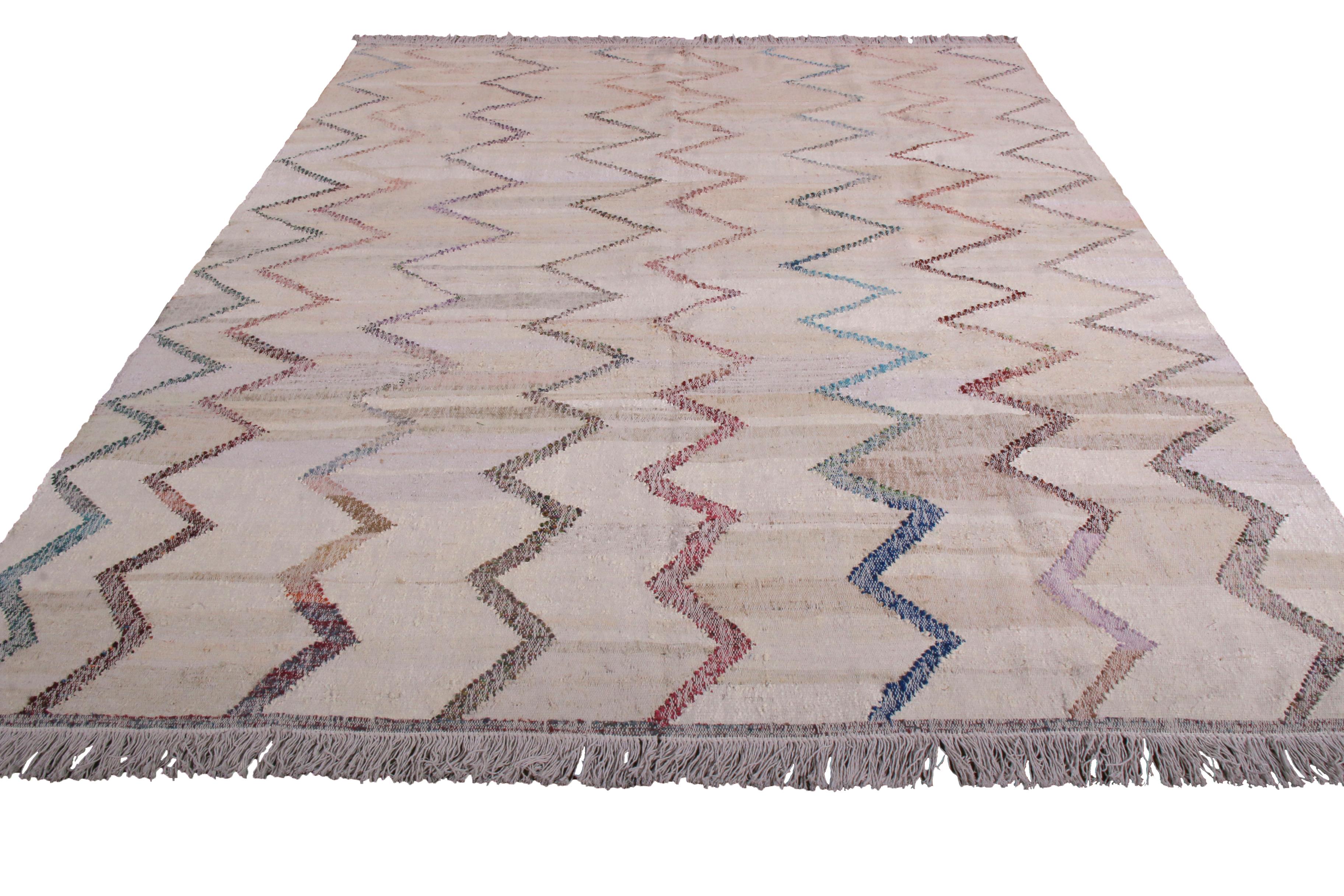 This contemporary Kilim represents a selection of distinct new patterns joining Rug & Kilim’s New and Modern collection, uniquely handwoven from the yarns of Classic textiles and Kilims to create this transitional flat-weave and its lively, varied