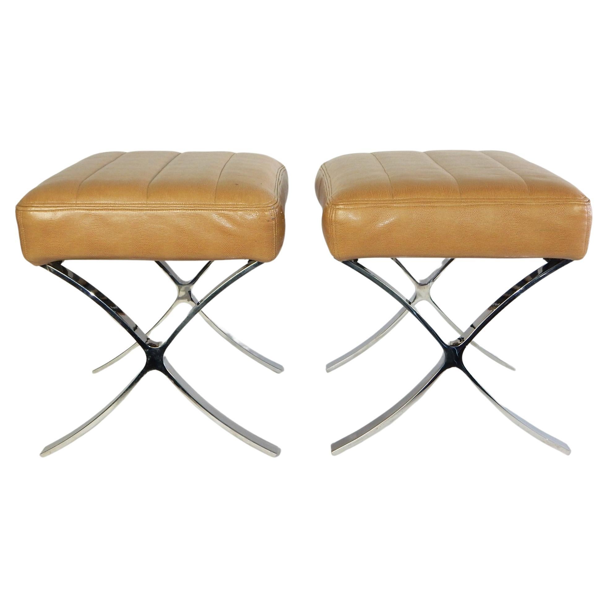 Heavy and well made, these smaller sized Barcelona style stools are
circa 1990s. Polished stainless steel X base with faux Shagreen leather upholstery. Cushions are attached. Made in the USA. 24