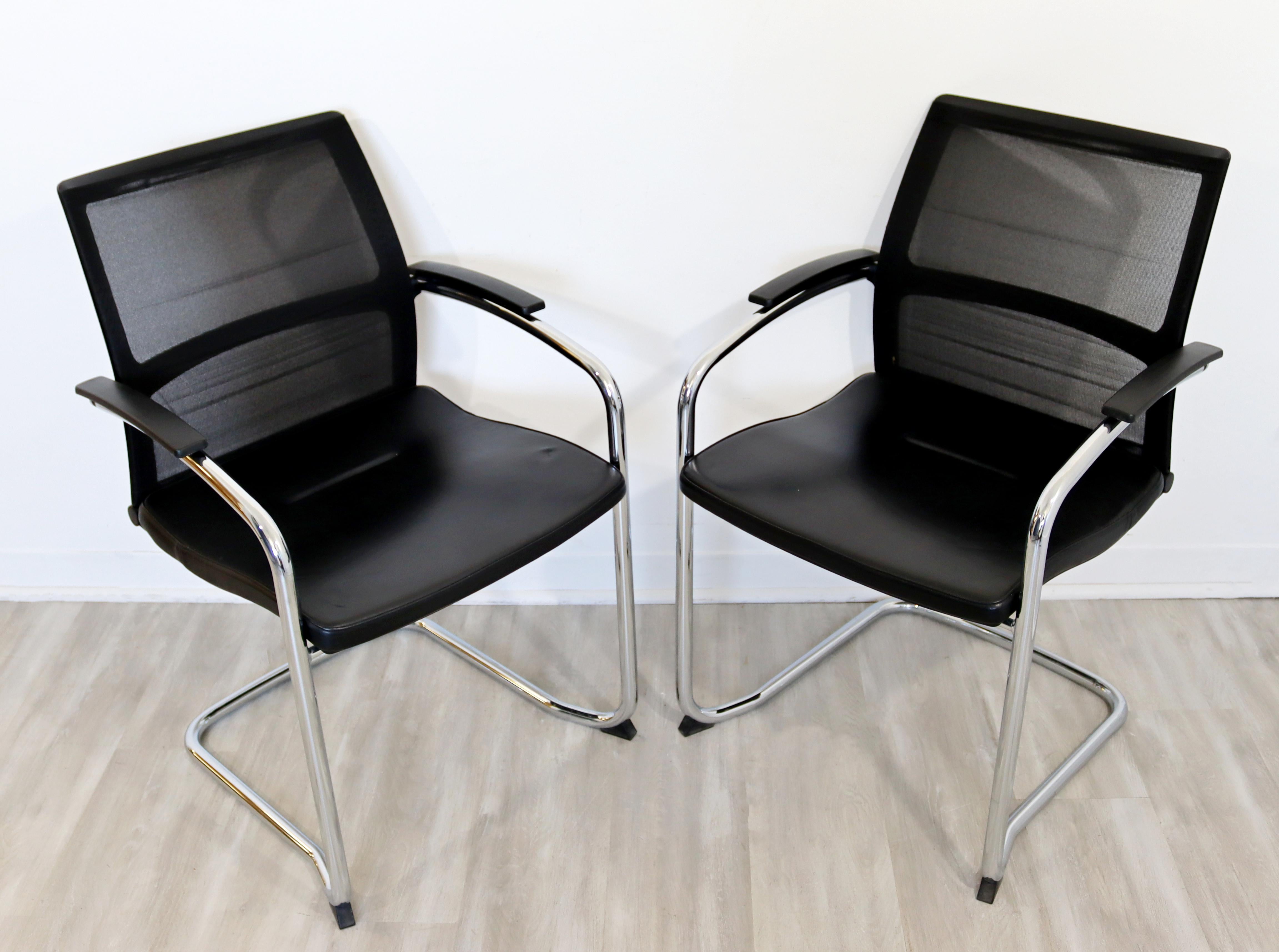 For your consideration is a stunning pair of Knoll dining or office chairs, on cantilever chrome bases, circa 2007. In excellent condition. The dimensions are 22.5