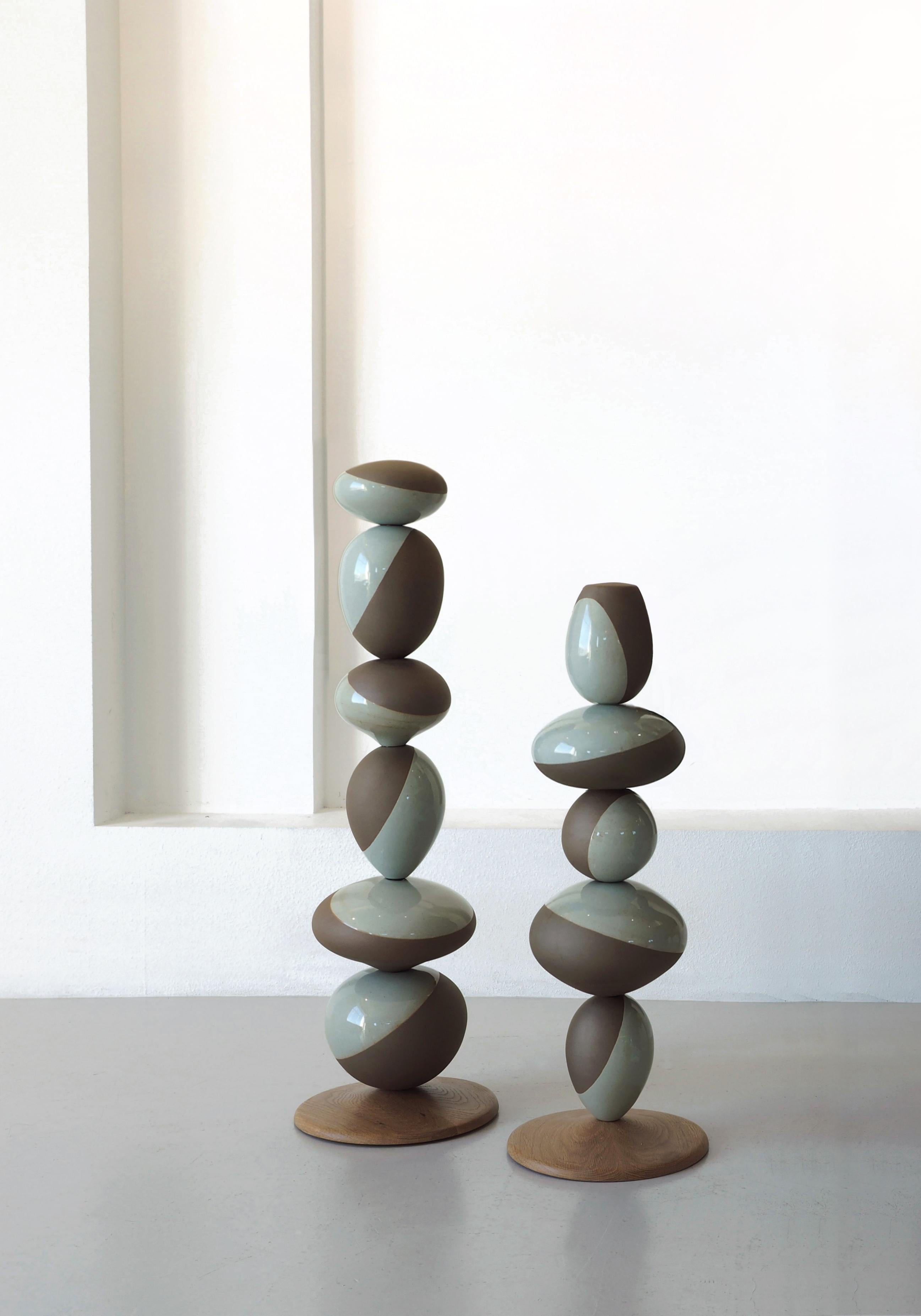 Large Stack Vessel is a stack sculpture made by Soo Joo in Korean ceramic stoneware and celadon glaze. Its timeless form expresses the ideal ratio and formal balance through a variety of vessel forms stacked in harmony. The artist reimagines the