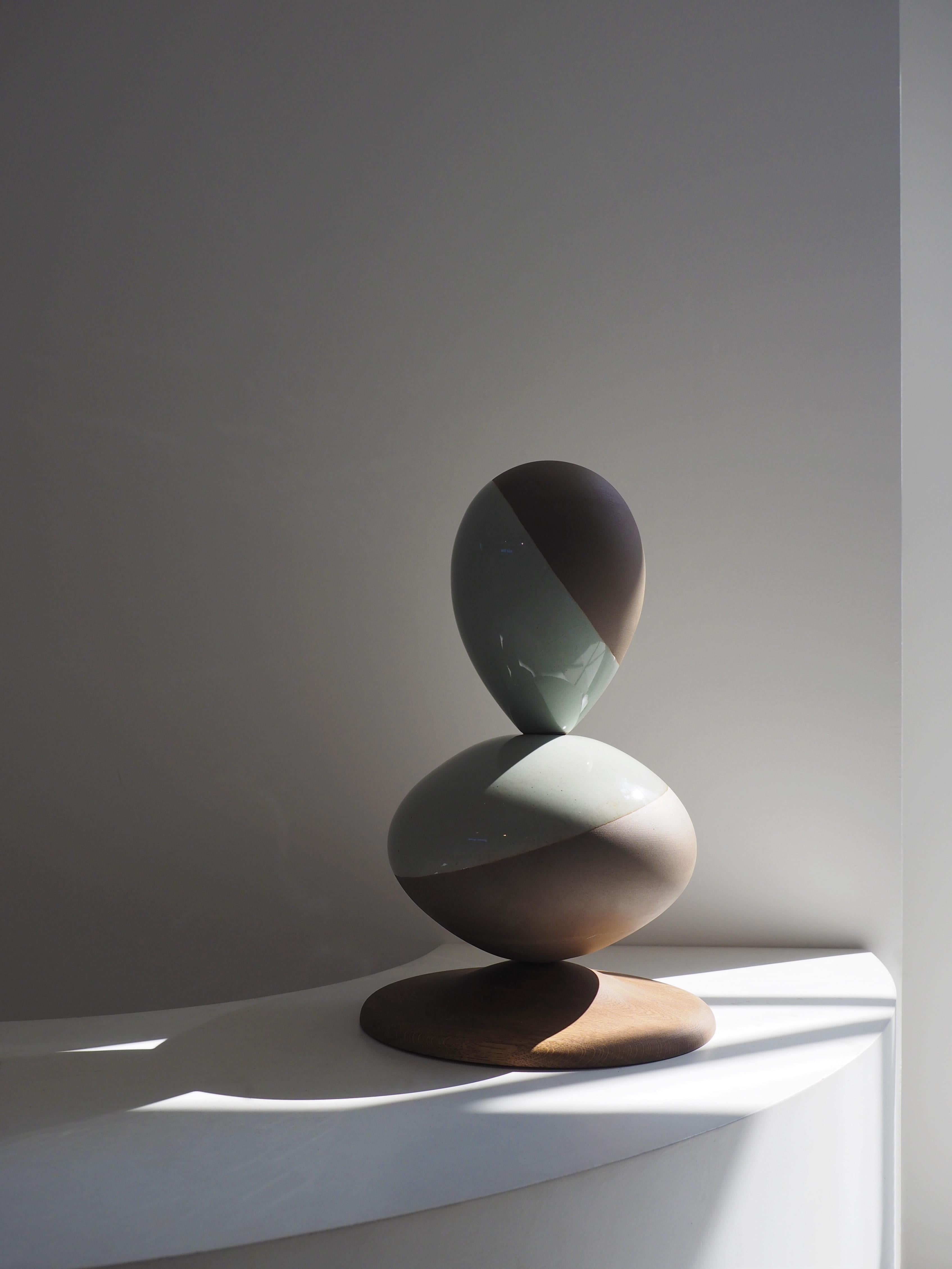 Stack sculpture Pair by Soo Joo is a stack sculpture made in Korean Ceramic. It is a timeless form, reminiscent of a pair of perfectly balanced river stones. The stack sculpture series is created with traditional Korean aesthetics in mind, using