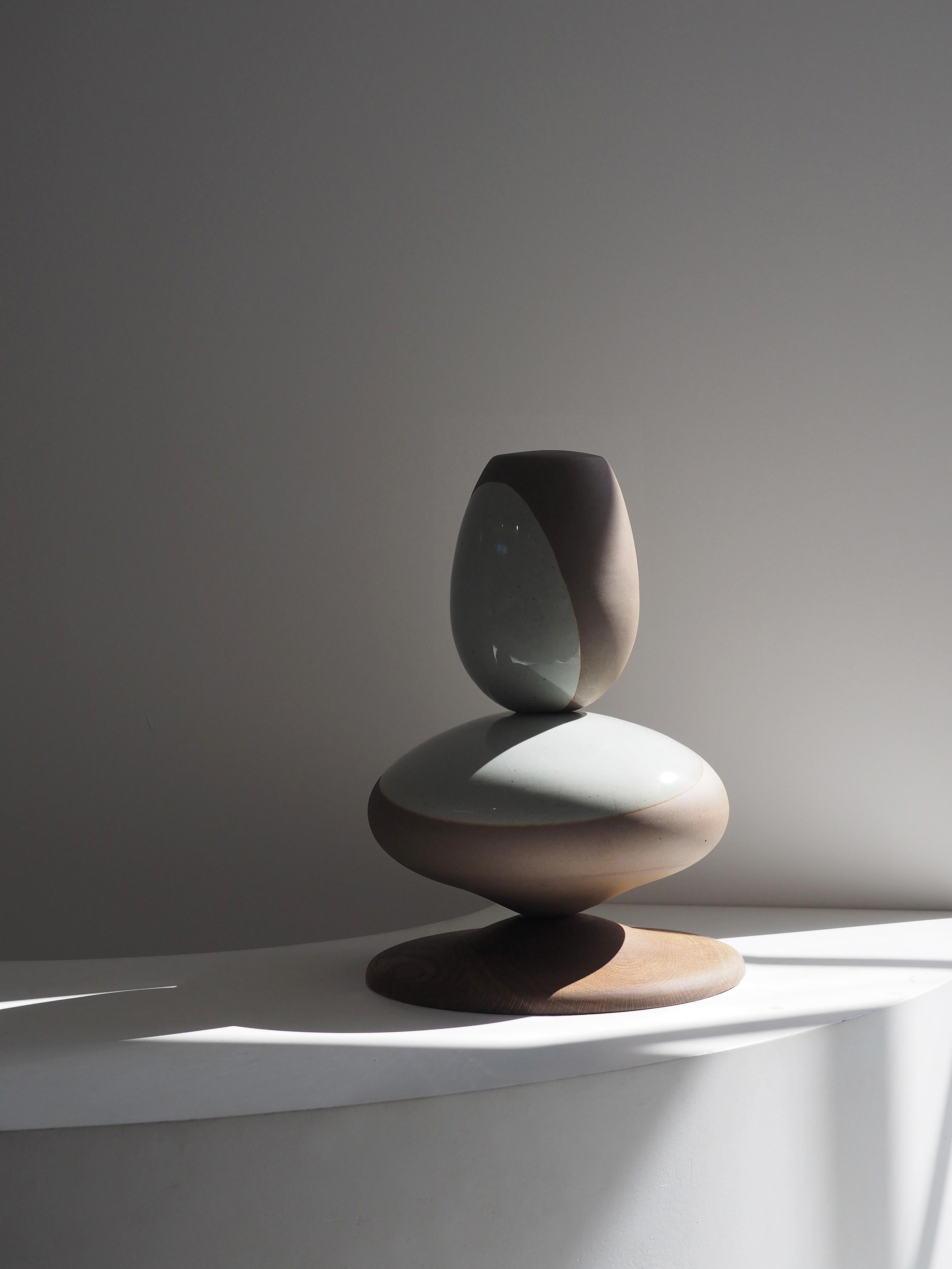 Stack sculpture pair by Soo Joo is a stack sculpture made in Korean Ceramic. It is a timeless form, reminiscent of a pair of perfectly balanced river stones. The stack sculpture series is created with traditional Korean aesthetics in mind, using