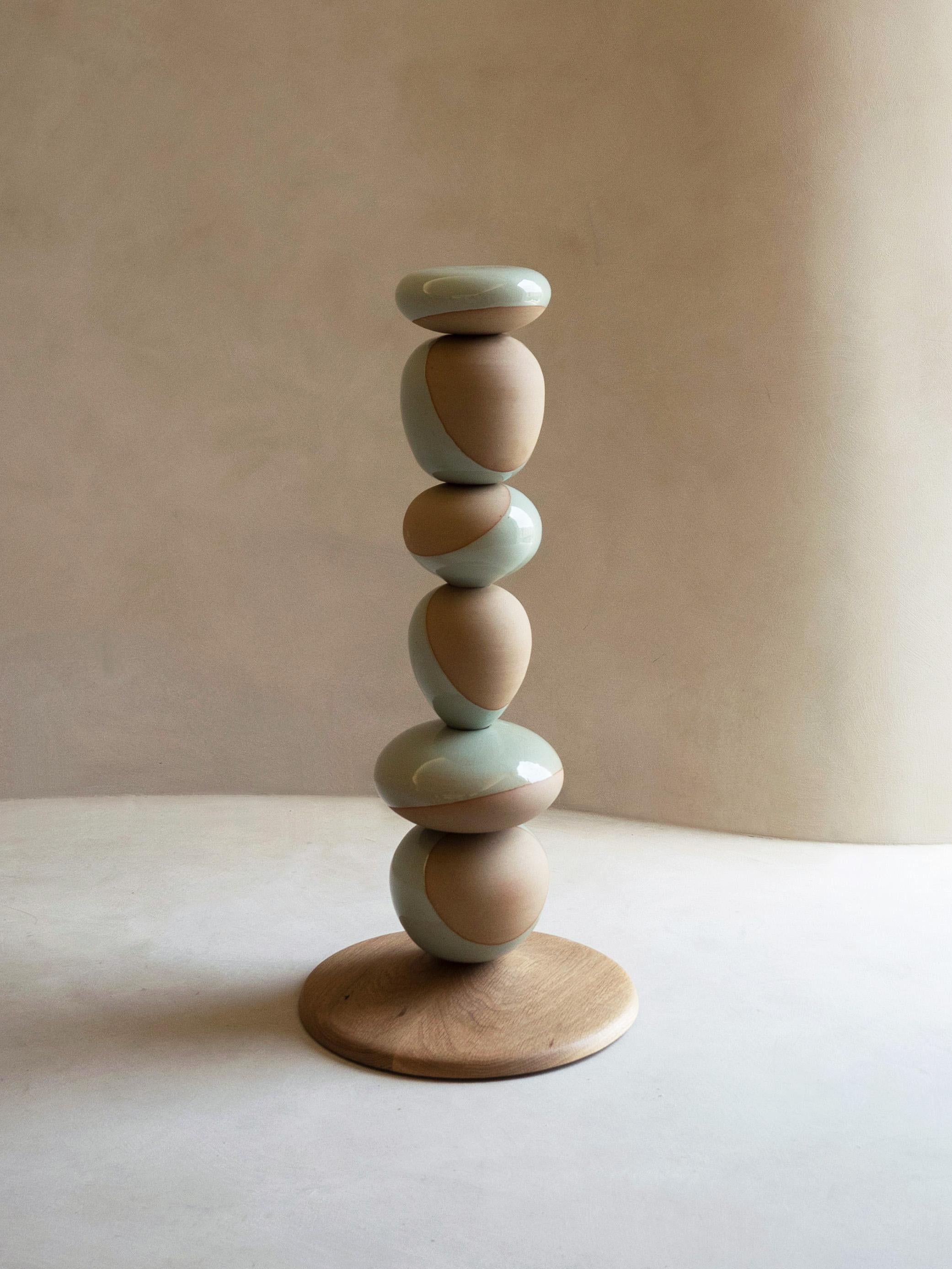 Stack Vessel II by Soo Joo is a stack sculpture made in Korean Ceramic. It is a timeless form, reminiscent of a stack of perfectly balanced river stones. This is the taller of the two Stack Vessel pairs. The Stack Vessel series is created with