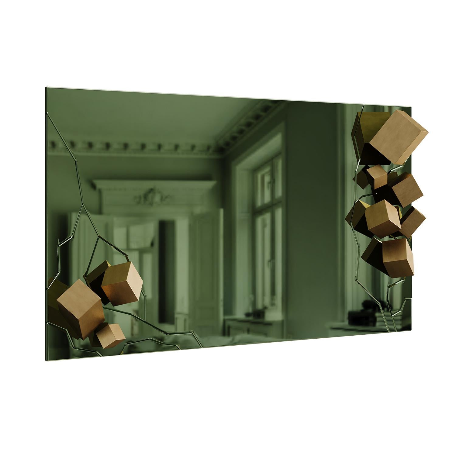 Fusión de arte y función, el Espejo Kubi trasciende el reflejo y redefine la percepción espacial mediante su presencia audaz y escultural. Los cortes precisos y rectos dan paso a elementos geométricos de latón que parecen romper el espejo. La