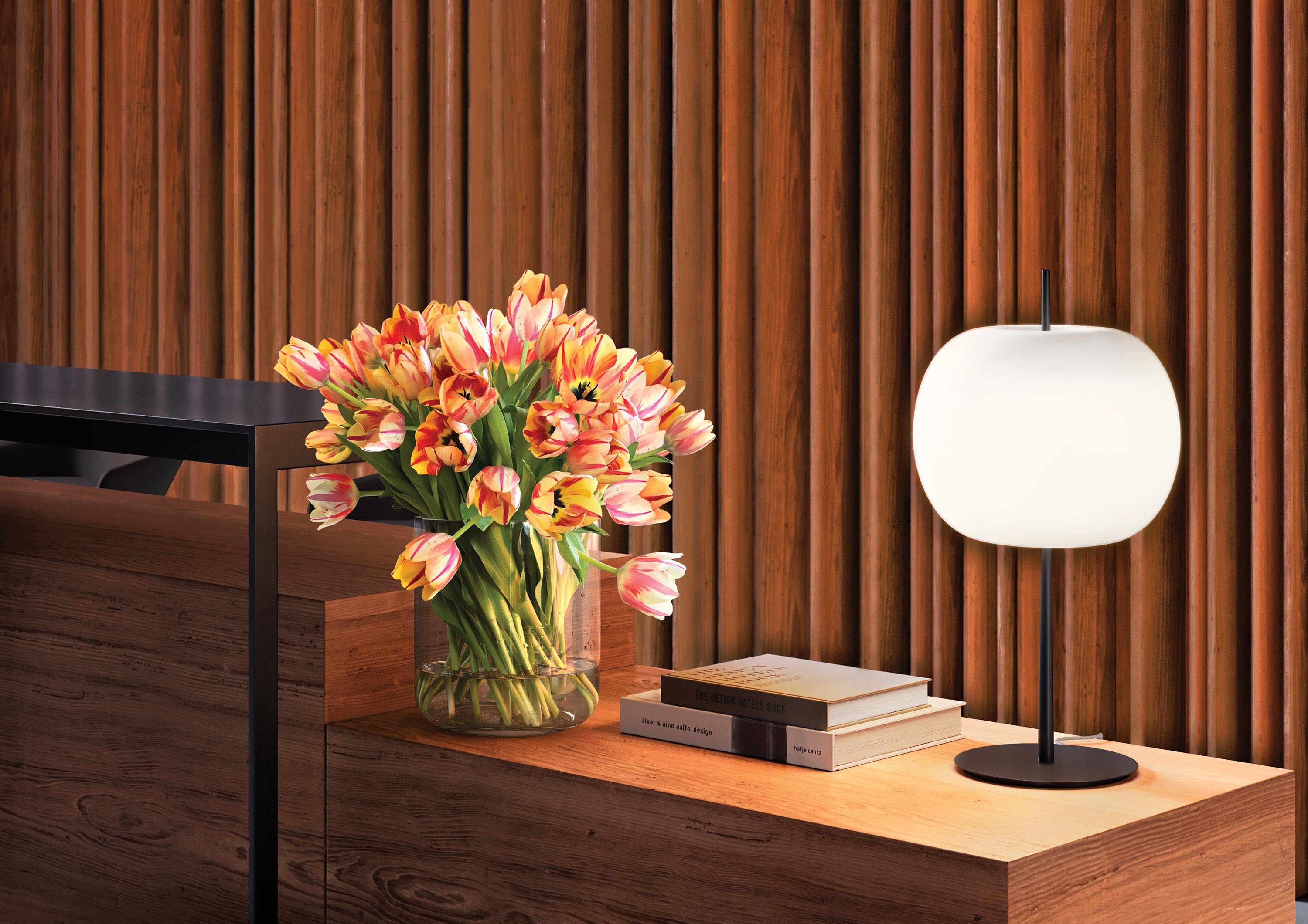 Kushi table XL black finish

A long, metal rod pierces the soft glass diffuser. The evocative intensity of the simplest and purest of shapes for an imposing lamp with a sophisticated and discrete presence. Dimmable table lamp. Opal diffuser made