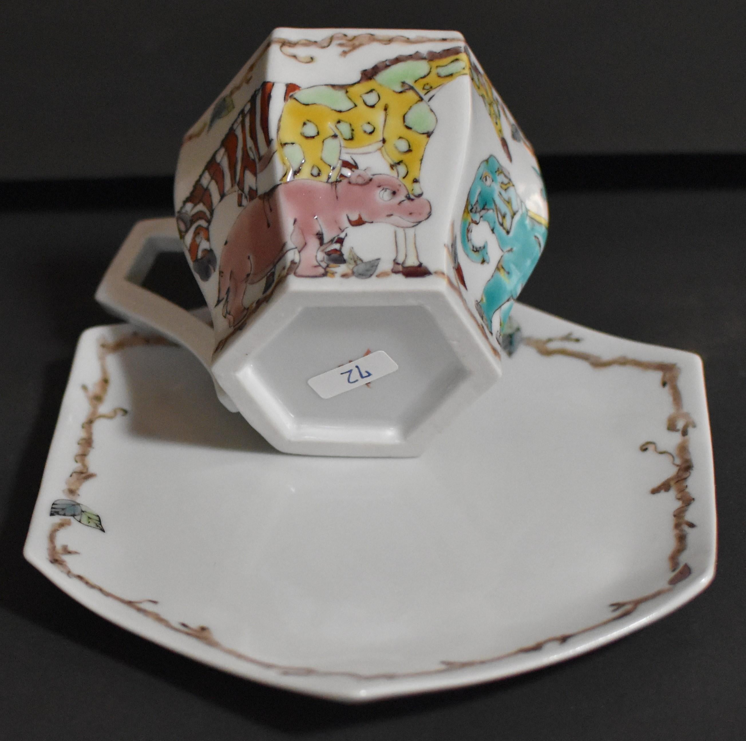 Contemporary Japanese handcrafted, hand painted cup and saucer in a unique hexagonal shape, with a unique interpretation of elephants and other animals.
Having started his career in the venerable tradition of old Kutani porcelain, the artist