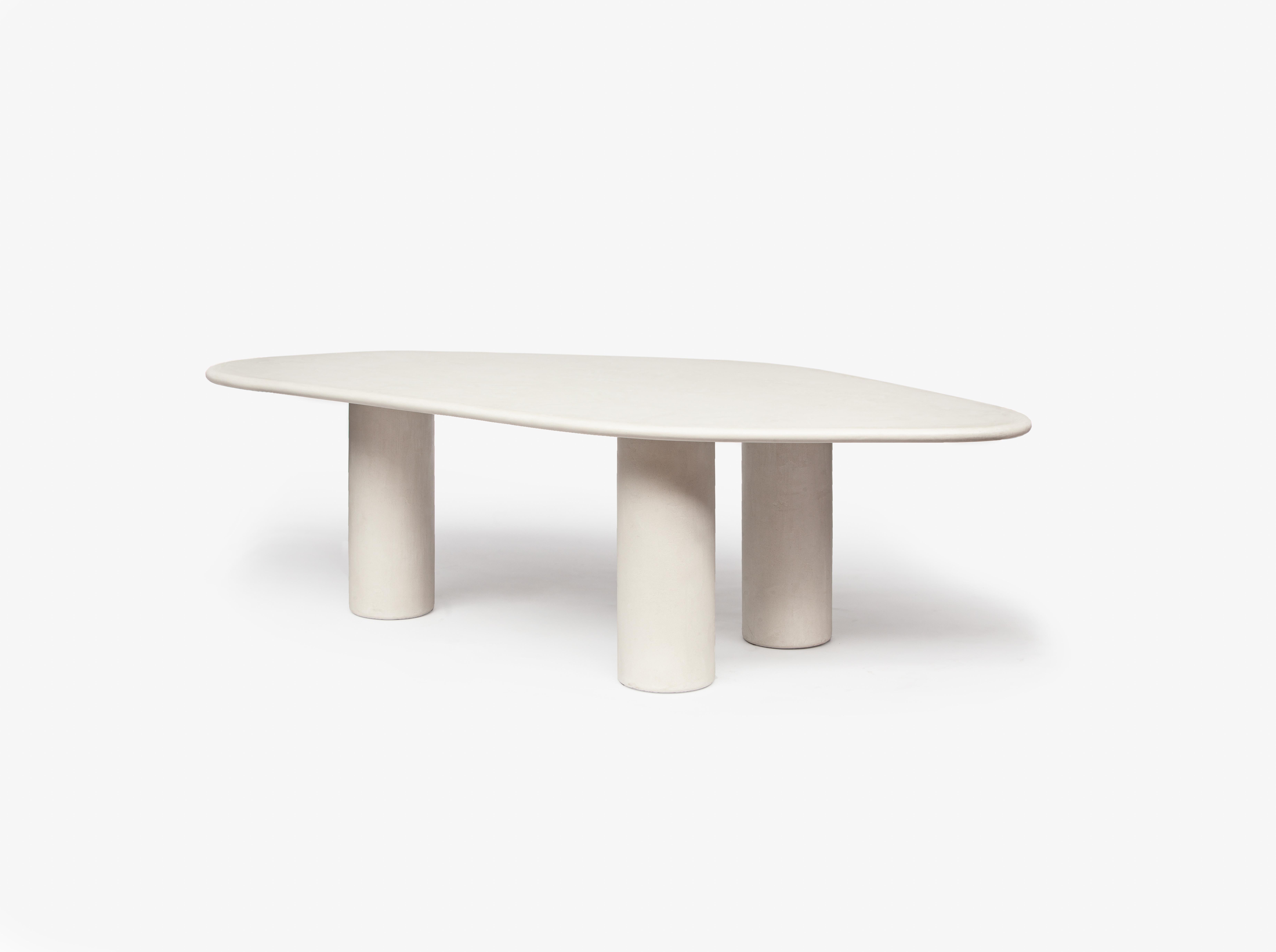 The Vézère collection pays homage to the French river, with its gentle curves and fluid forms. Organic and flowing lines. The shape of the tables was created from pebbles found in the river. 

Starting from a base of plywood, layers of Mortex© are