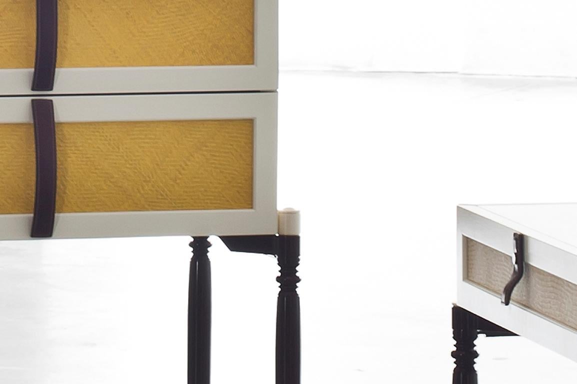 4 drawer dresser in lacquered wood feature appliquéd panels of woven straw while slender metal legs.

The fine line of St. Barths collection are inspired by the furniture and luggage explorers carried on their journeys through the colonies.
The