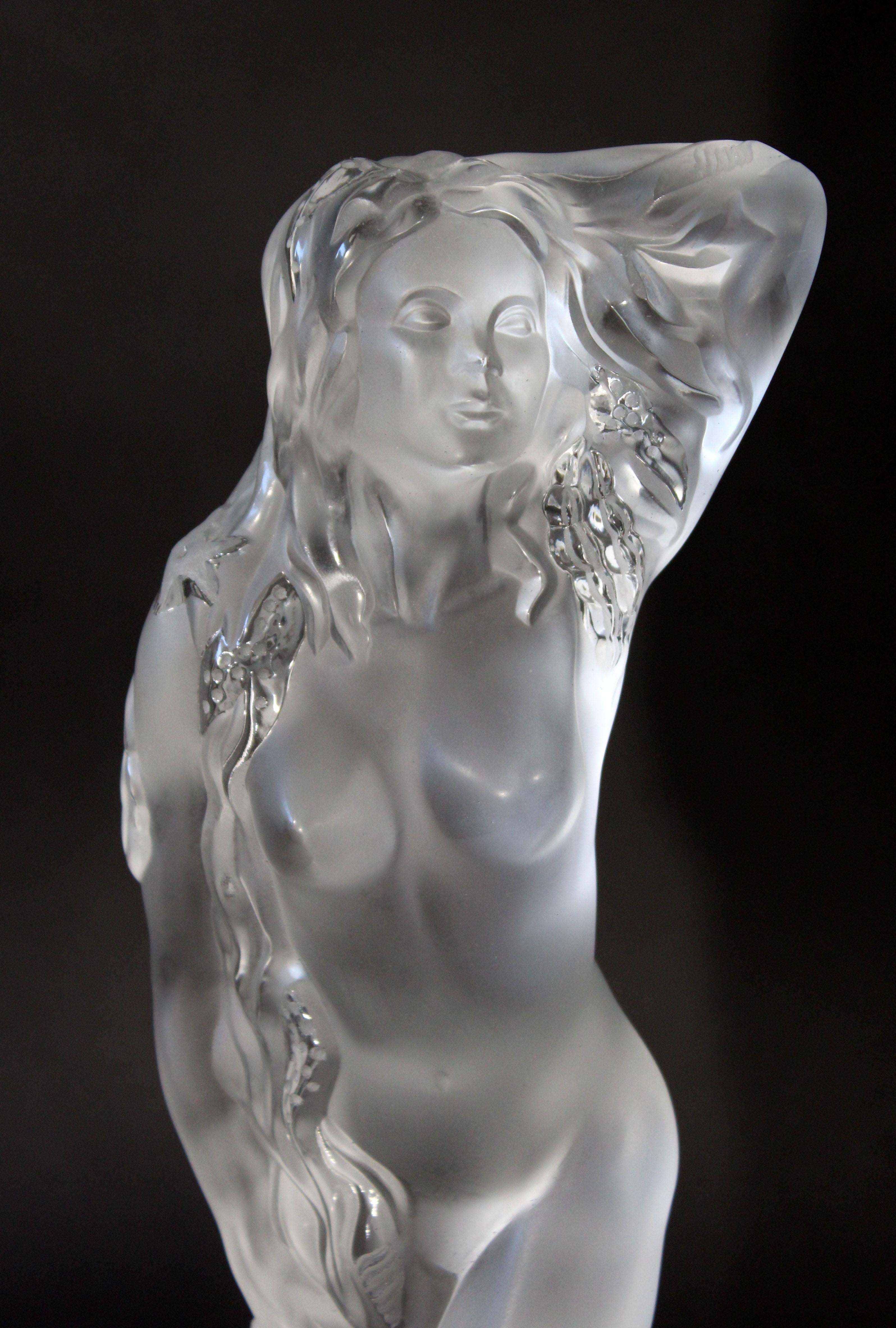 For your consideration is a marvelously sensual, Lalique crystal sculpture of a nude woman who is covered in sea shells, signed and numbered 32/999. This piece is titled Ocean Ide. Comes with original box. In excellent condition. The dimensions are