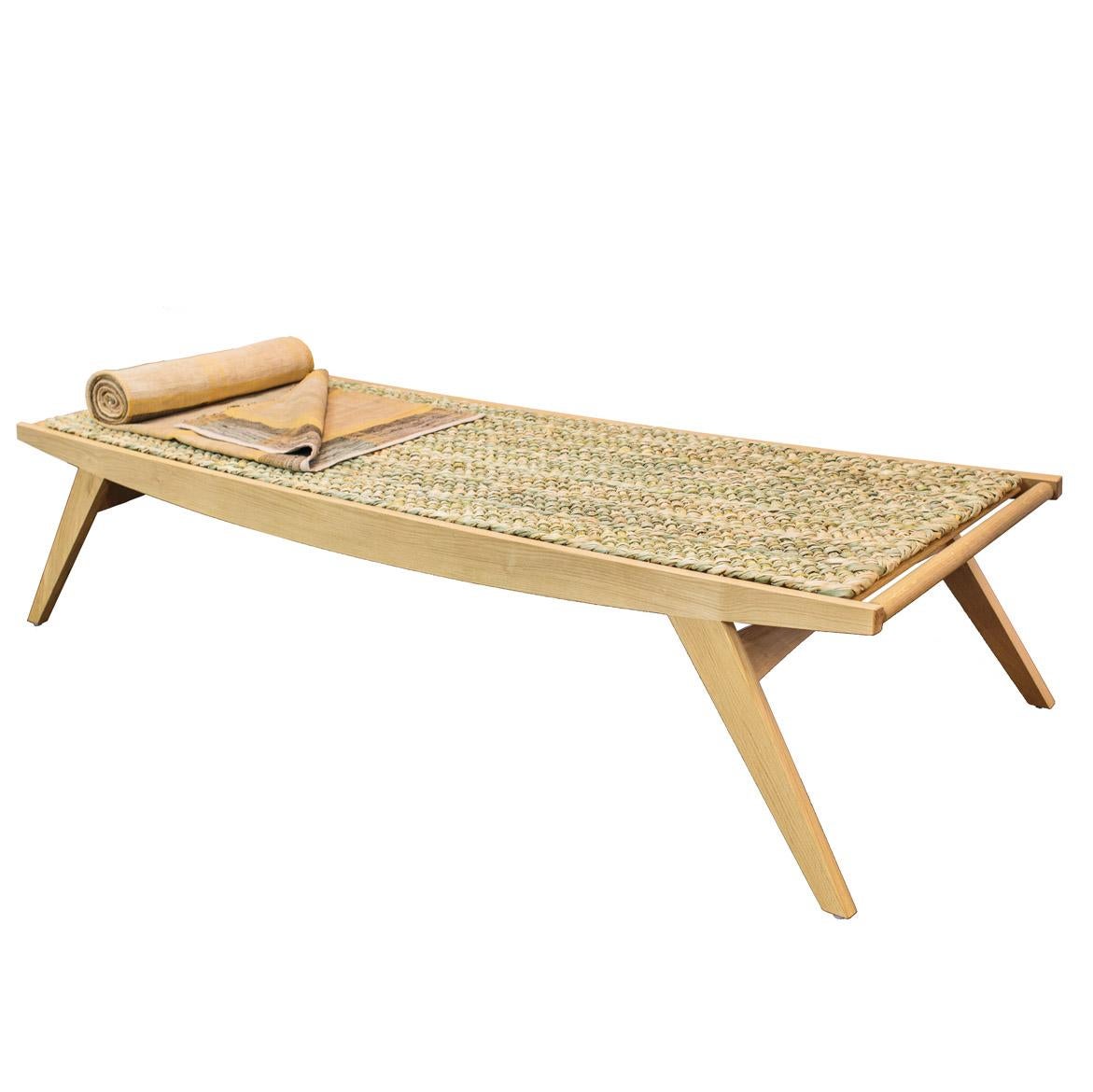 Our Lambda daybed is handmade in small batches from sustainably sourced oak. Both modern and traditional joinery techniques are employed, ensuring the best attention to detail and quality. The mat is woven from English rushes.

Our iconic pi stool