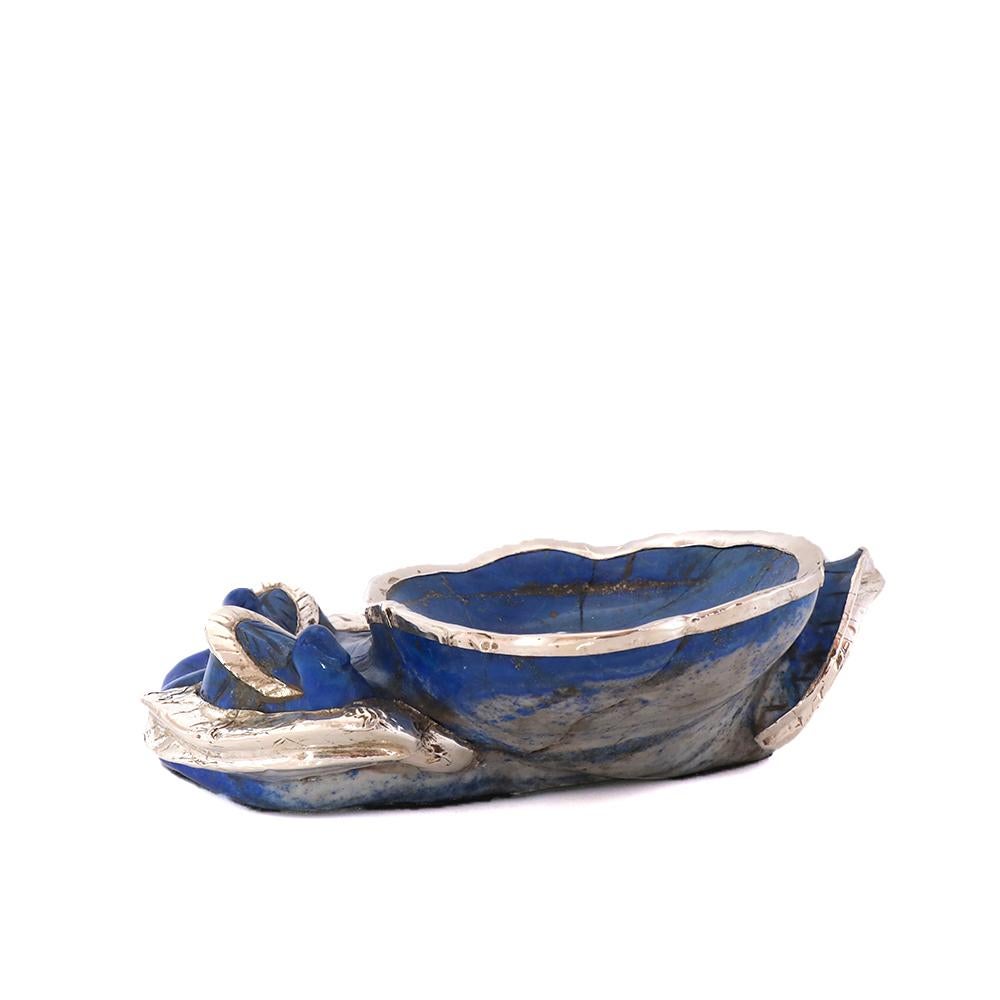 Contemporary Lapis Lazuli ashtray with sterling silver 925 apllications is a modern piece by Alcino Silversmith 1902.

This piece was designed and produced in our workshop in Porto, Portugal. 
It is in Lapis Lazuli and Sterling silver 925