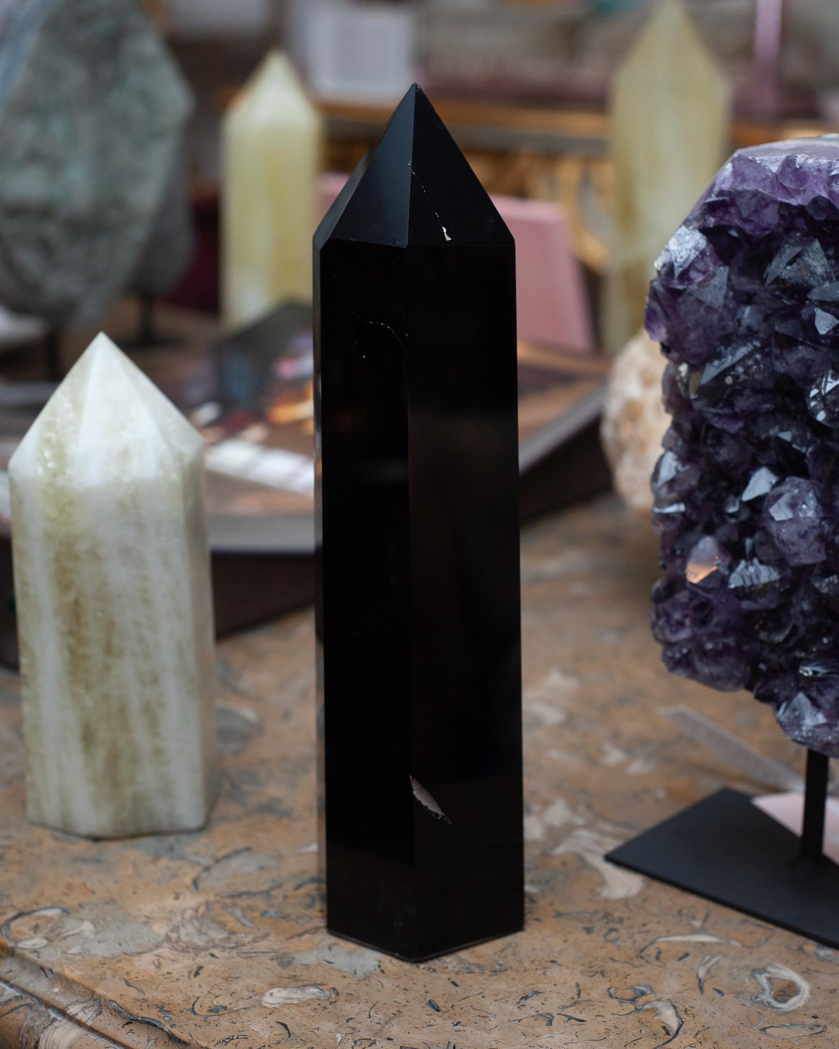 Invite healing energy into your home with a contemporary large black obsidian crystal point / obelisk. Gorgeous in a collection, or as a stand alone statement piece. Obelisks are symbols of protection, defence and stability. Crystal points are often
