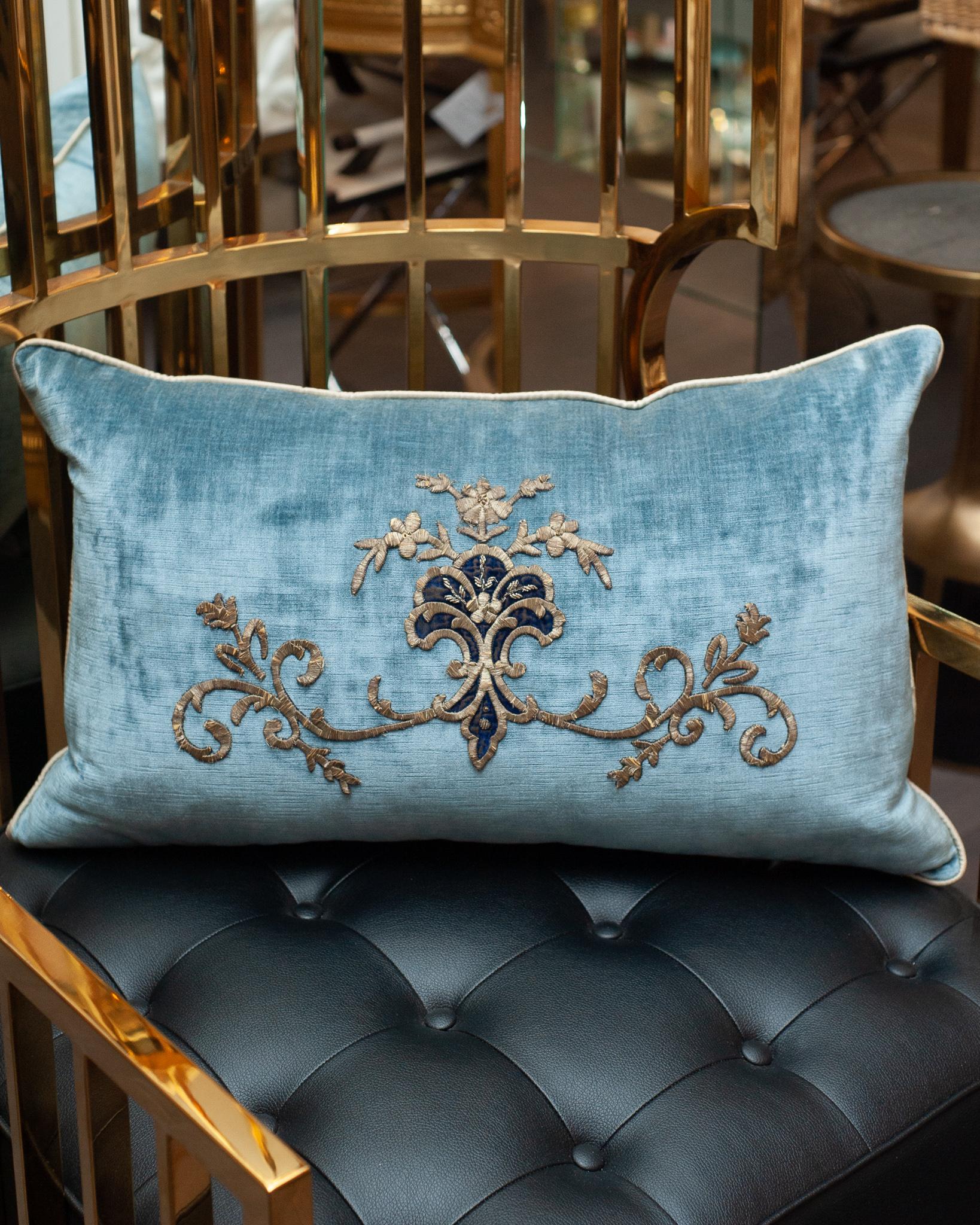 A stunning large blue velvet pillow with hand-stitched Antique Ottoman metallic embroidery. Filled with a down and feather insert for a pillow that is as soft and luxurious as it is beautiful.