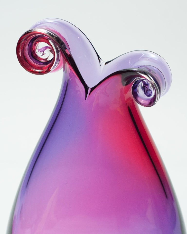 A stunning contemporary red and purple blown glass curly vase by a Canadian artist.