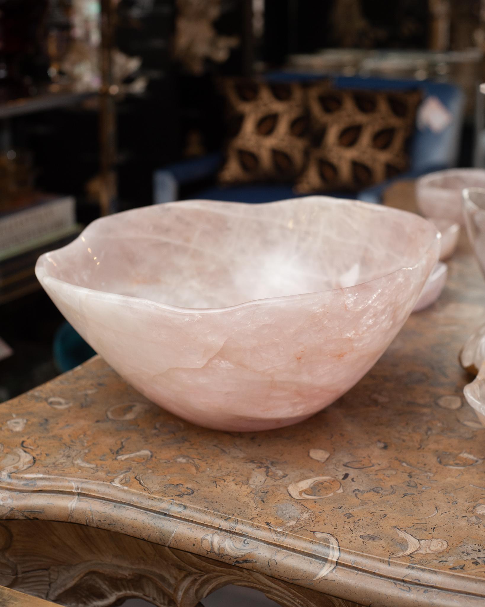 Bring the healing energy of rose quartz into your home with this beautiful large finely carved bowl. This substantial carved bowl can filled on a kitchen island or kept sculptural as an empty vessel and placed in any space. Rose quartz, the