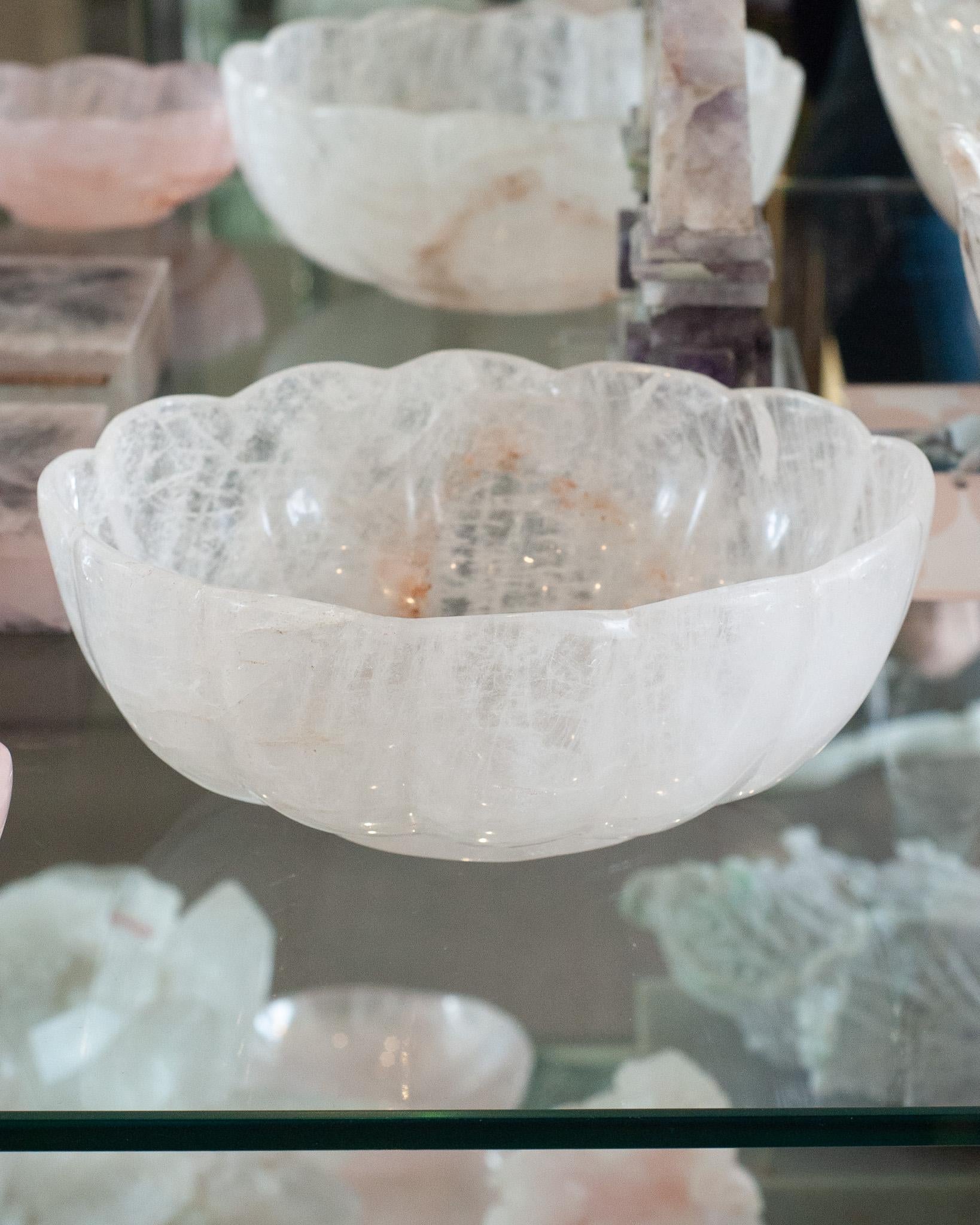 Bring the healing energy of rock crystal into your home with this large scale beautiful carved bowl. This carved oval Rock Crystal bowl with scalloped edges was sourced in Paris. The quality of the carving as well as its size, indicate its rarity.
