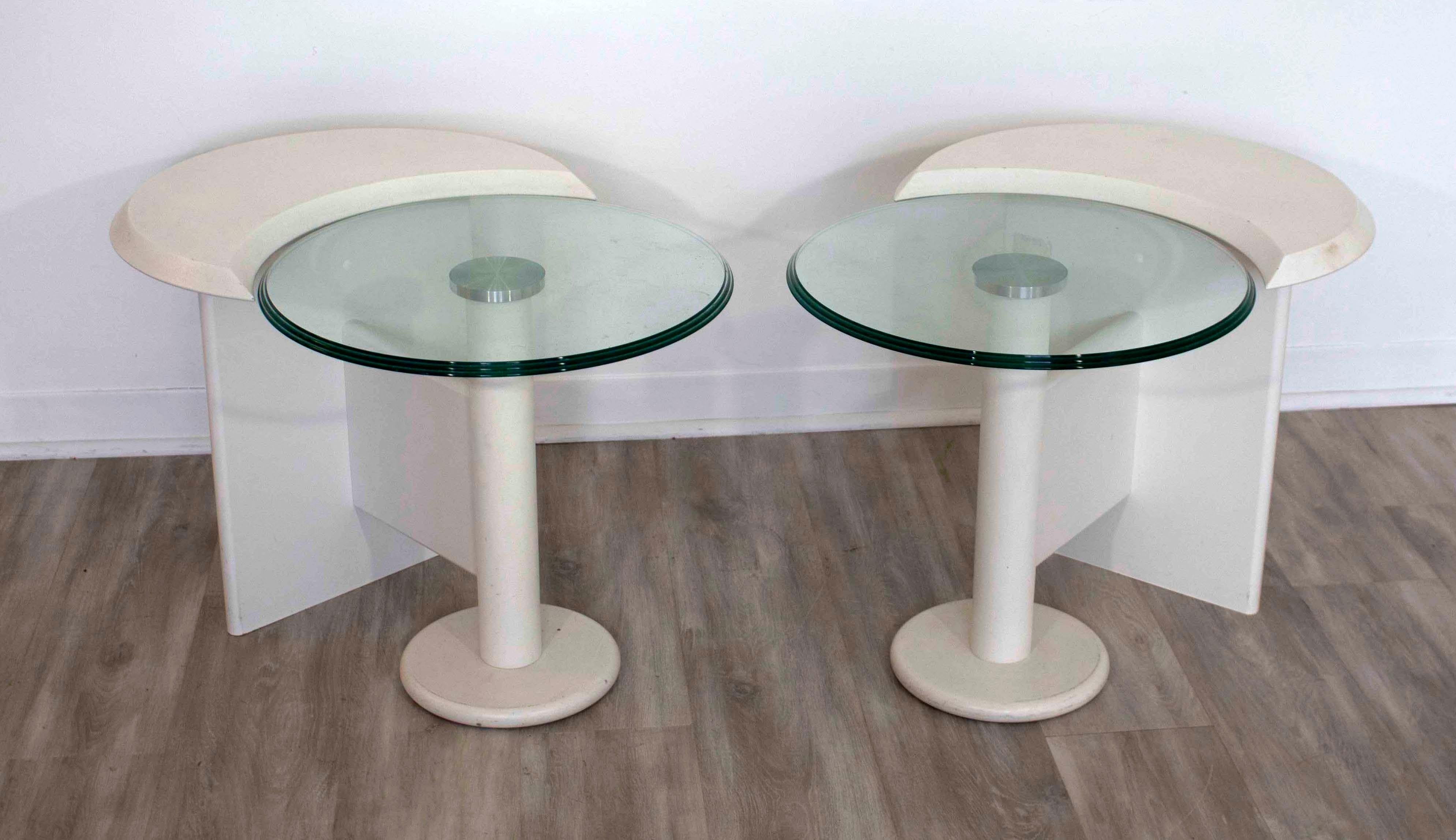 For your consideration is a pair of modernist side tables with glass made by Laurier, circa 1980s (20.25”H x 30.5”W x 27”D). In excellent condition.
  