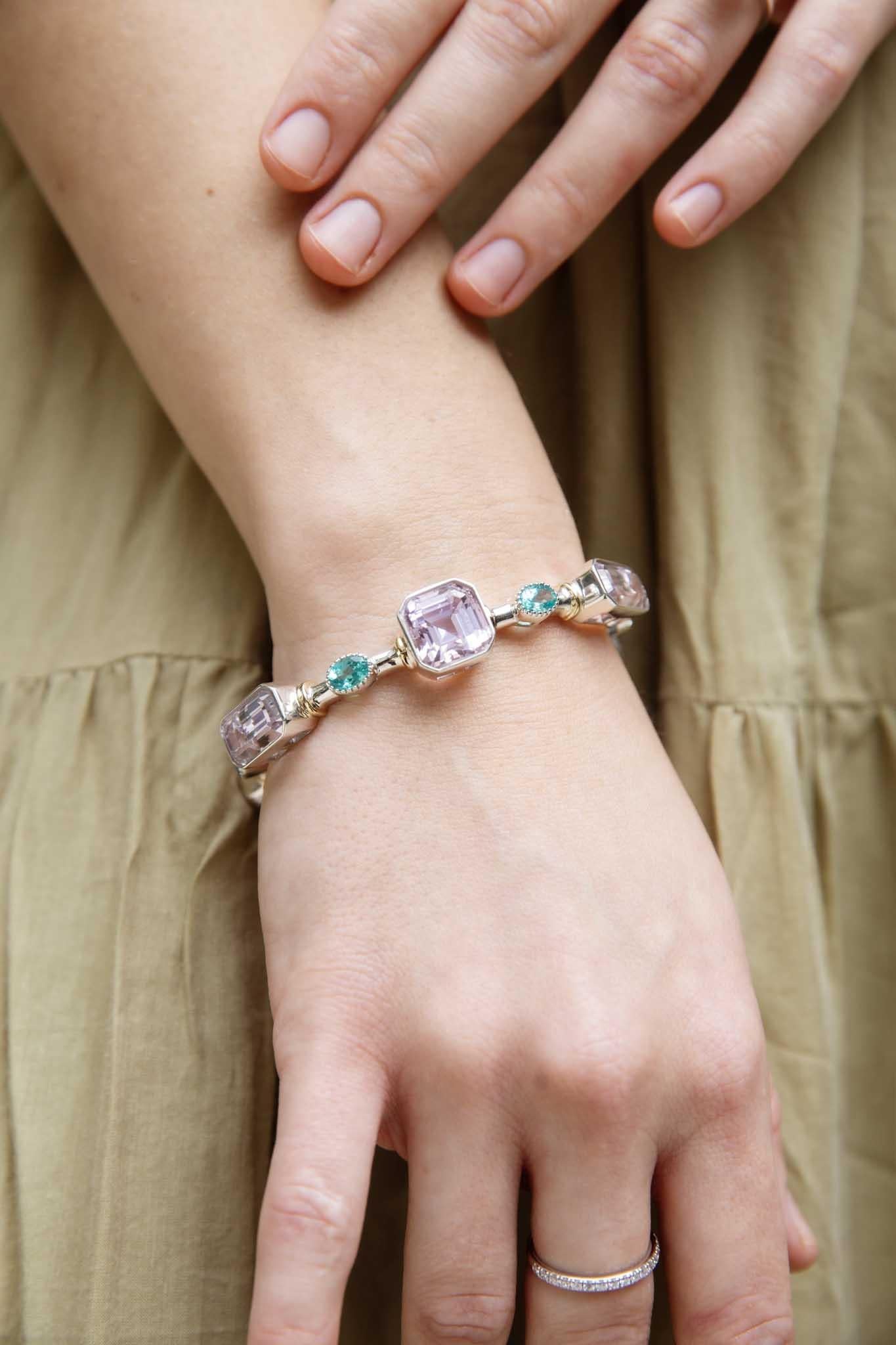 Inika 

pastel skies 
on sunny days
lilac haze and 
quiet
reminding us 
of times so precious
never taken away

The gorgeous Inika Bangle holds a plethora of kunzite and bright aqua colour apatite gemstones in her stunning silver glory. 

The Inika