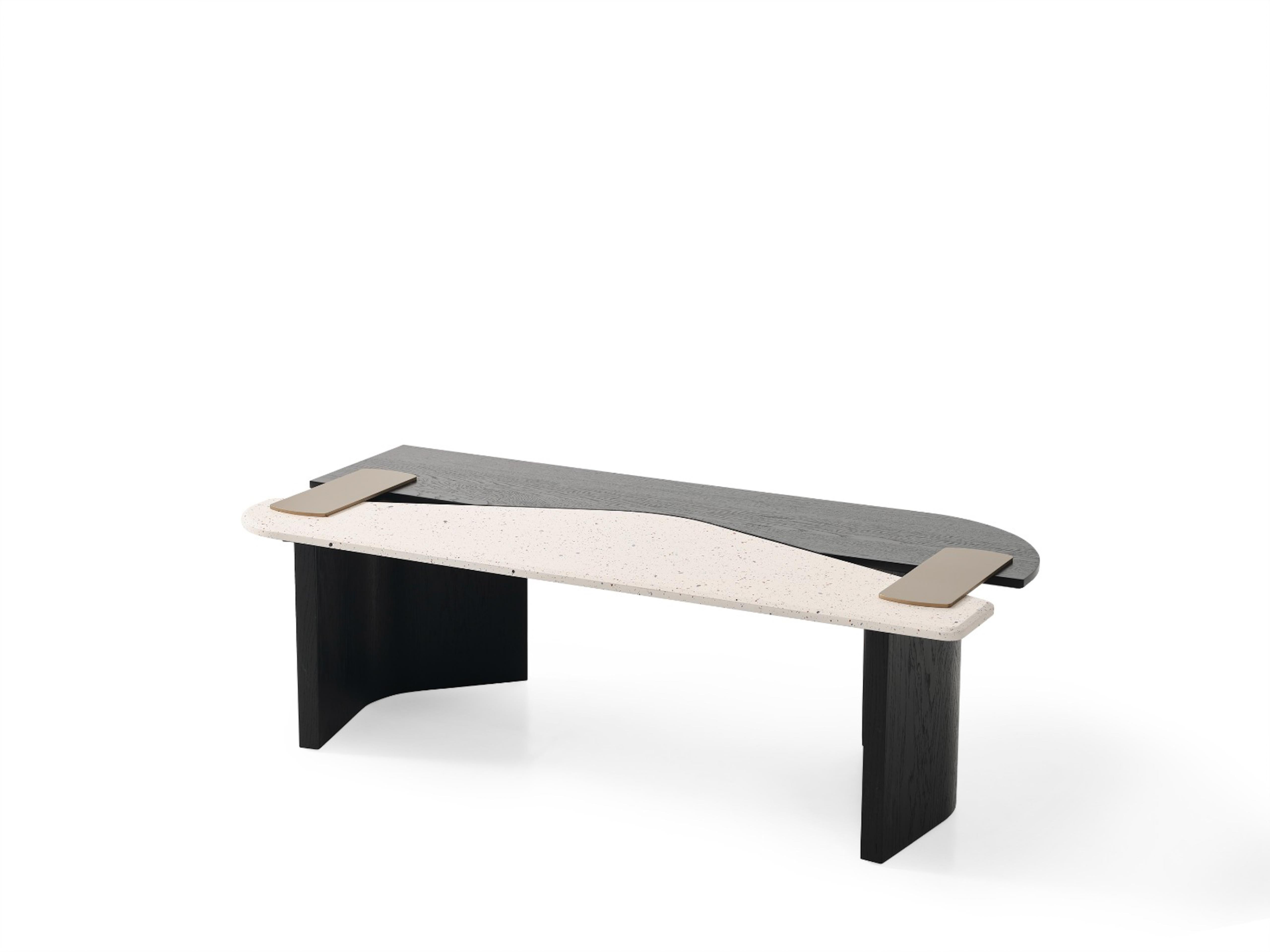 This contemporary coffee table is a striking exploration of layered geometry, material contrast, and refined craftsmanship. Entirely crafted from solid oak, the design features two interlocking wood panels in contrasting finishes — a warm,