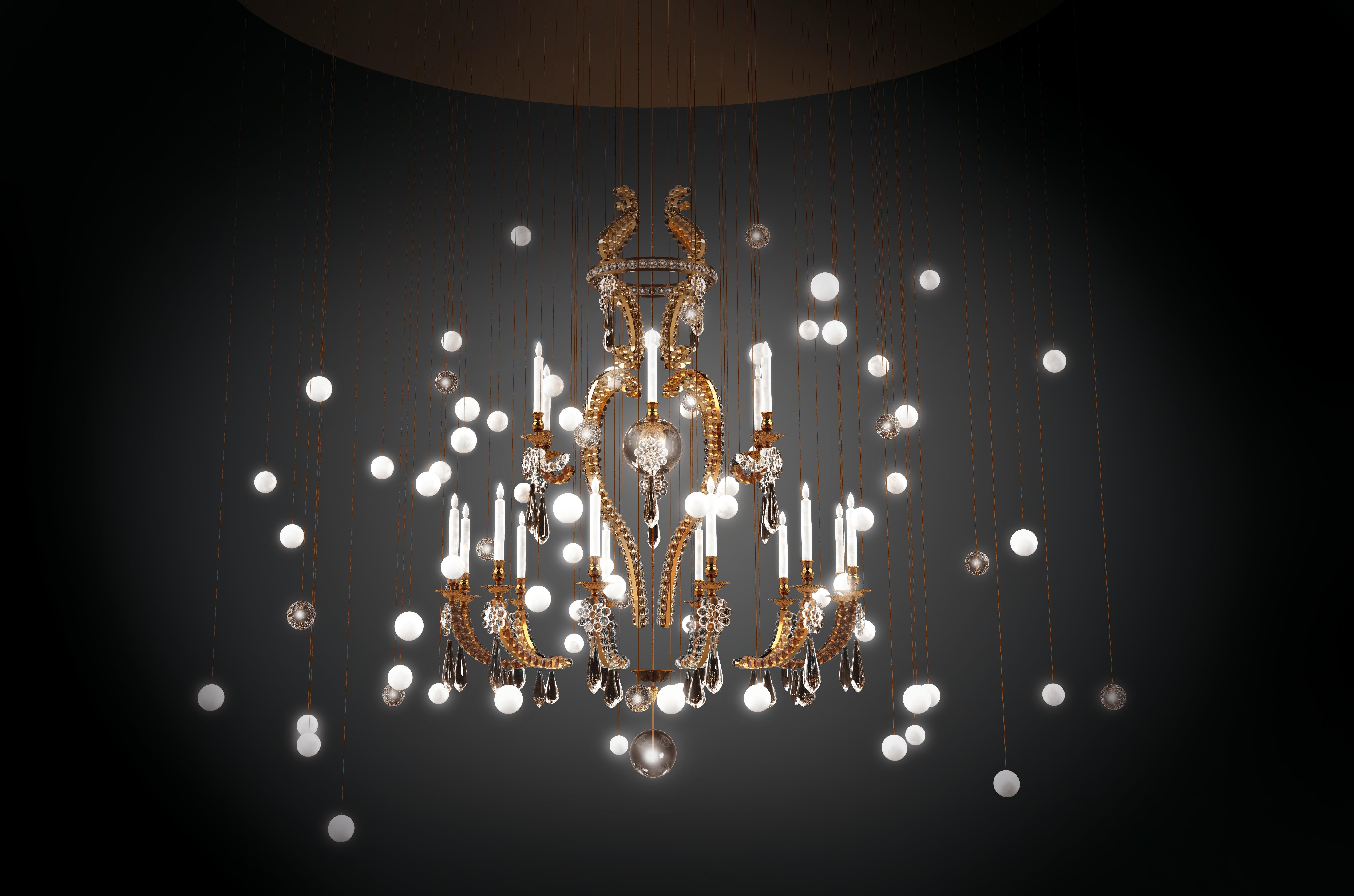 The Bespoke chandelier Le Merveilleux – Le Black is designed by Sylvie Maréchal and by Jean Delisle and it is entirely manufactured in France. This chandelier is made in bronze and has 17 spheres in mouth blown glass, 64 spheres in handmade Limoges