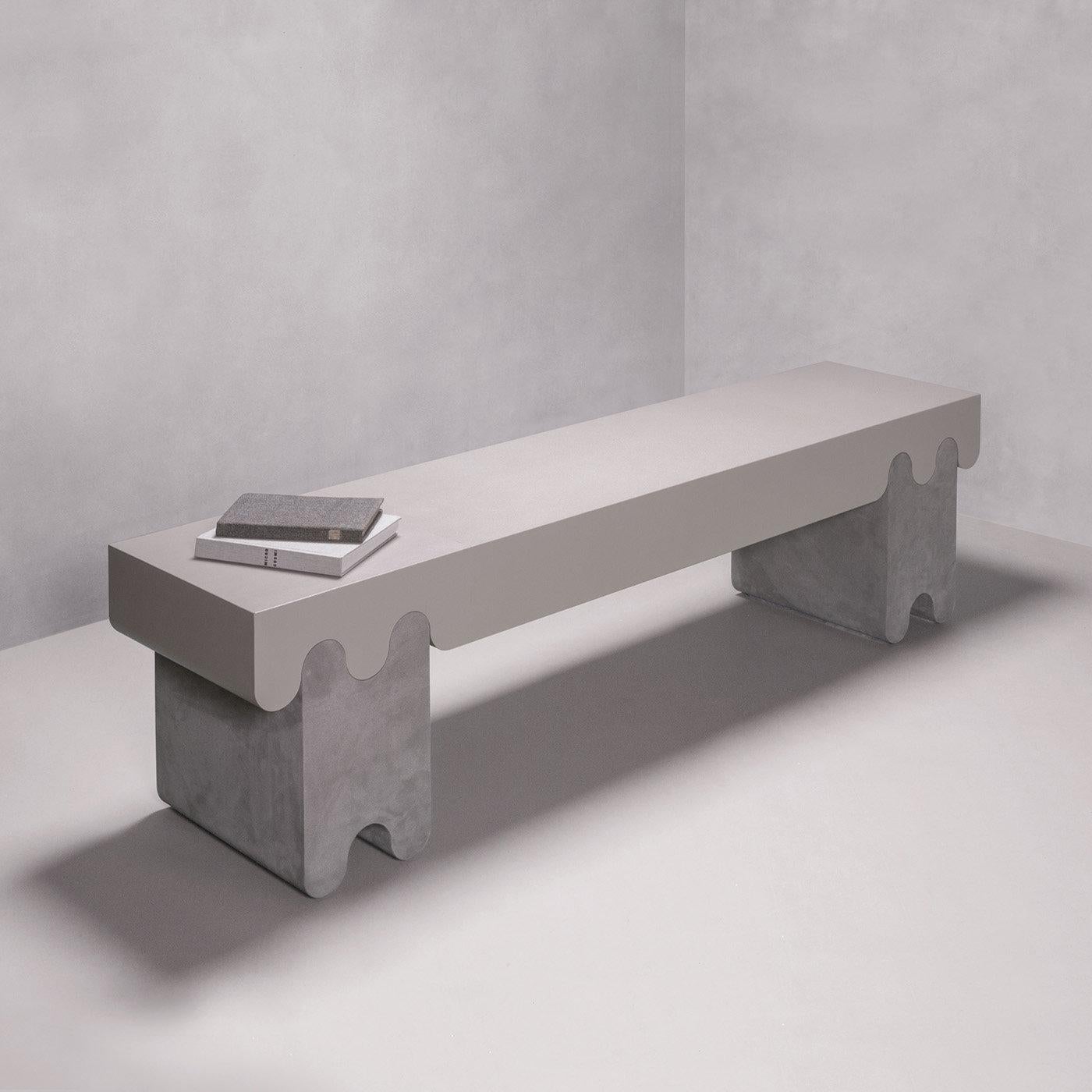 Contemporary leather bench - Ossicle N. 2 by Francesco Balzano for Giobagnara.
The object presented in the image has following finish: F83 stone nappa leather (top) and A89 feather suede leather. (legs)

Inspired by the sleek and timeless shapes