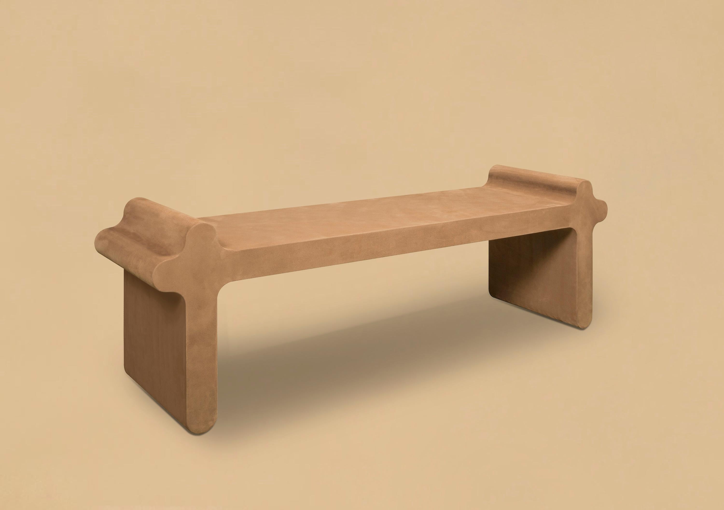 Contemporary suede leather bench - ossicle N.1 by Francesco Balzano for Giobagnara.
The object presented in the image has following finish: A30 tobacco suede leather.

A clean and essential design distinguished by smooth and delicate lines, this