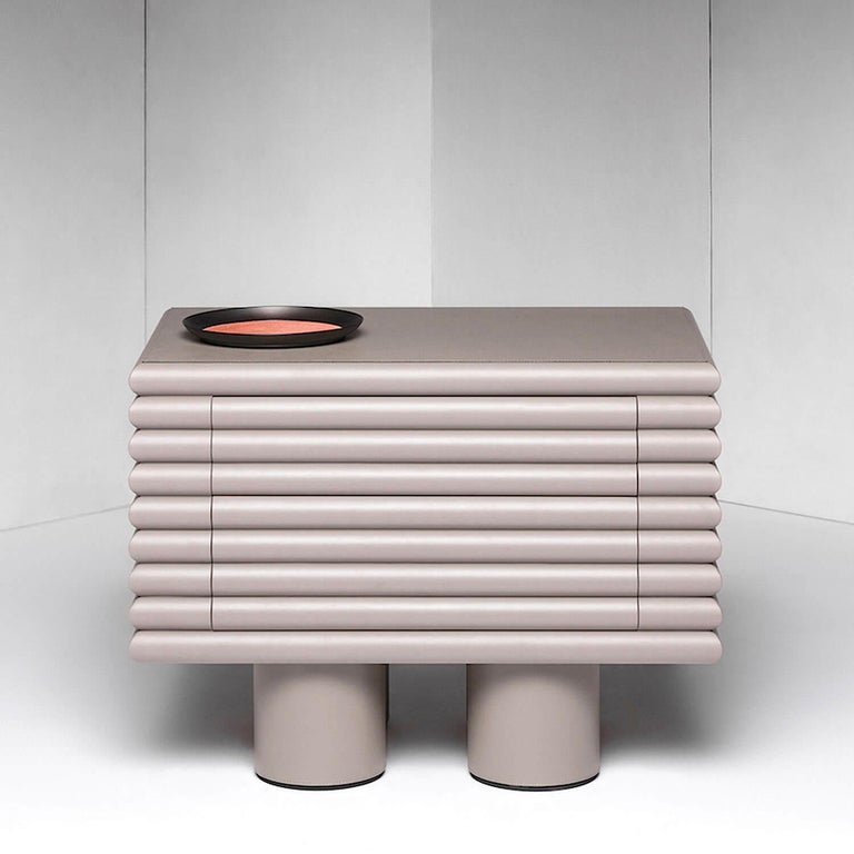 Two drawers chest of drawers / nightstand by Stephane Parmentier for Giobagnara. 
The object presented in the image has following finish: F06 Ivory Nappa Leather

A superb piece of functional decor showcasing a captivating design aesthetic, this