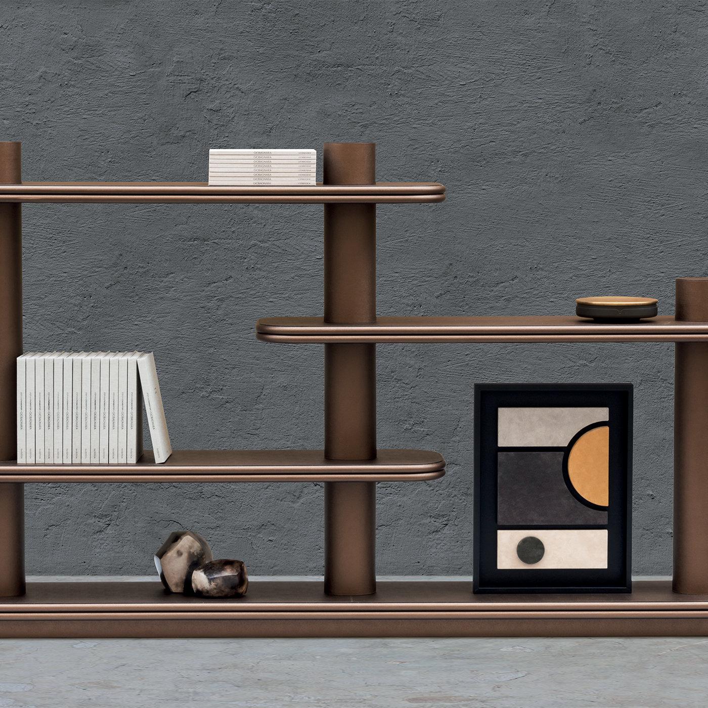 Double bookcase by Stephane Parmentier for Giobagnara. 
The object presented in the image has following finish: F82 Rust Nappa Leather

Entirely wrapped in soft brown nappa leather, this sophisticated bookcase is an exercise in balanced volumes