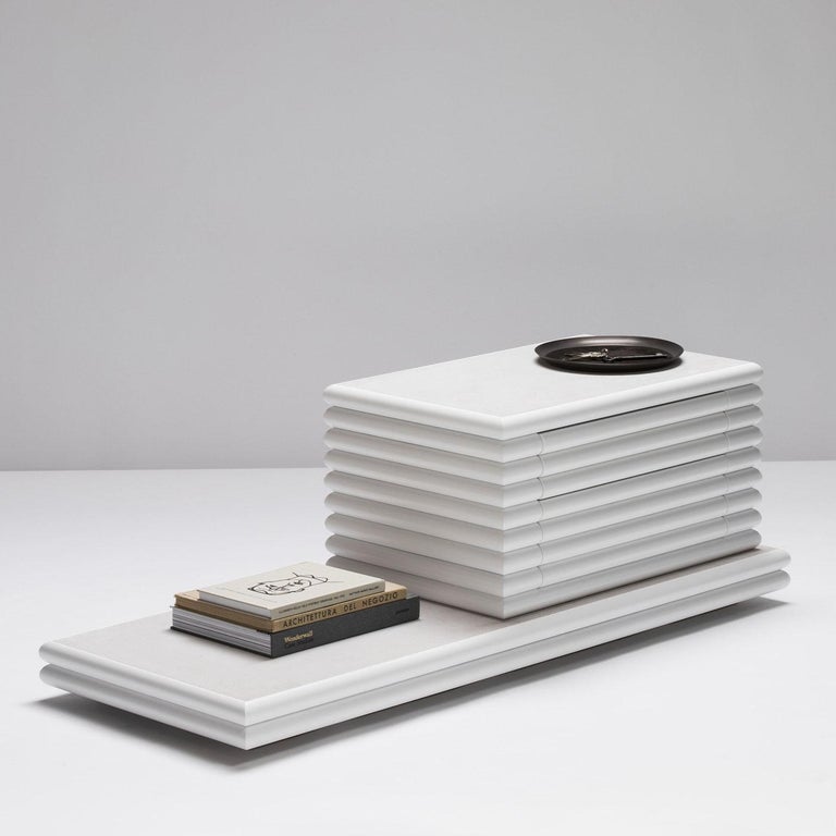 Contemporary leather nightstand scala by Stephane Parmentier for Giobagnara.
Two drawers.
The object presented in the image has following finish: F05 White Nappa Leather

An original silhouette with a dynamic, contemporary design defines this