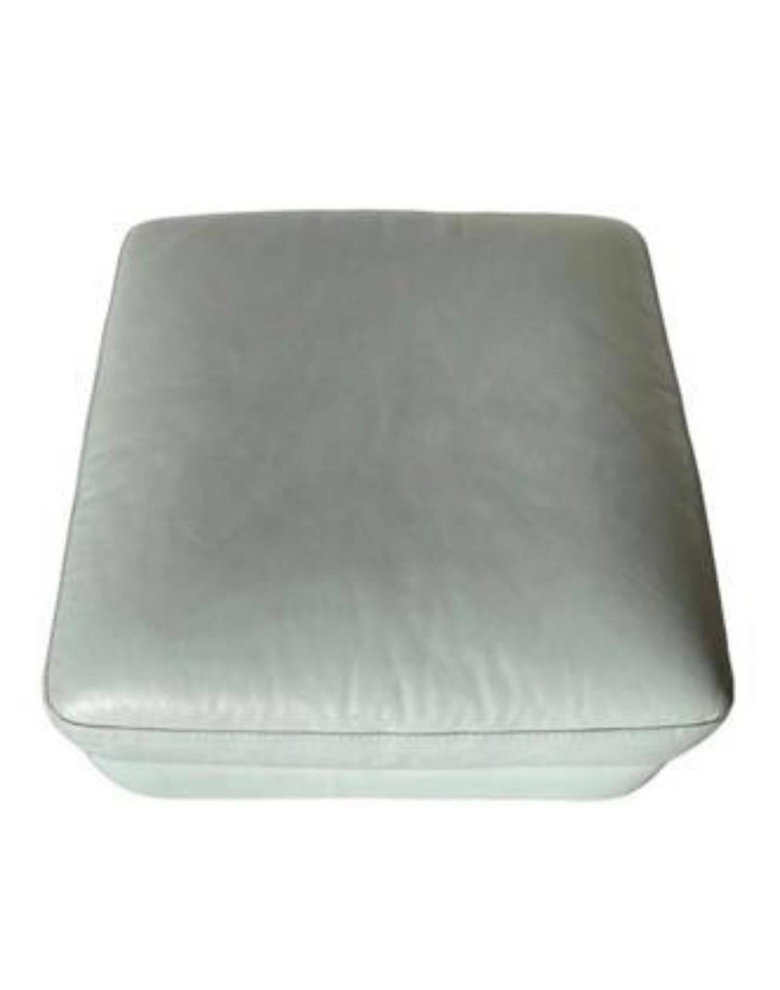 green leather ottoman
