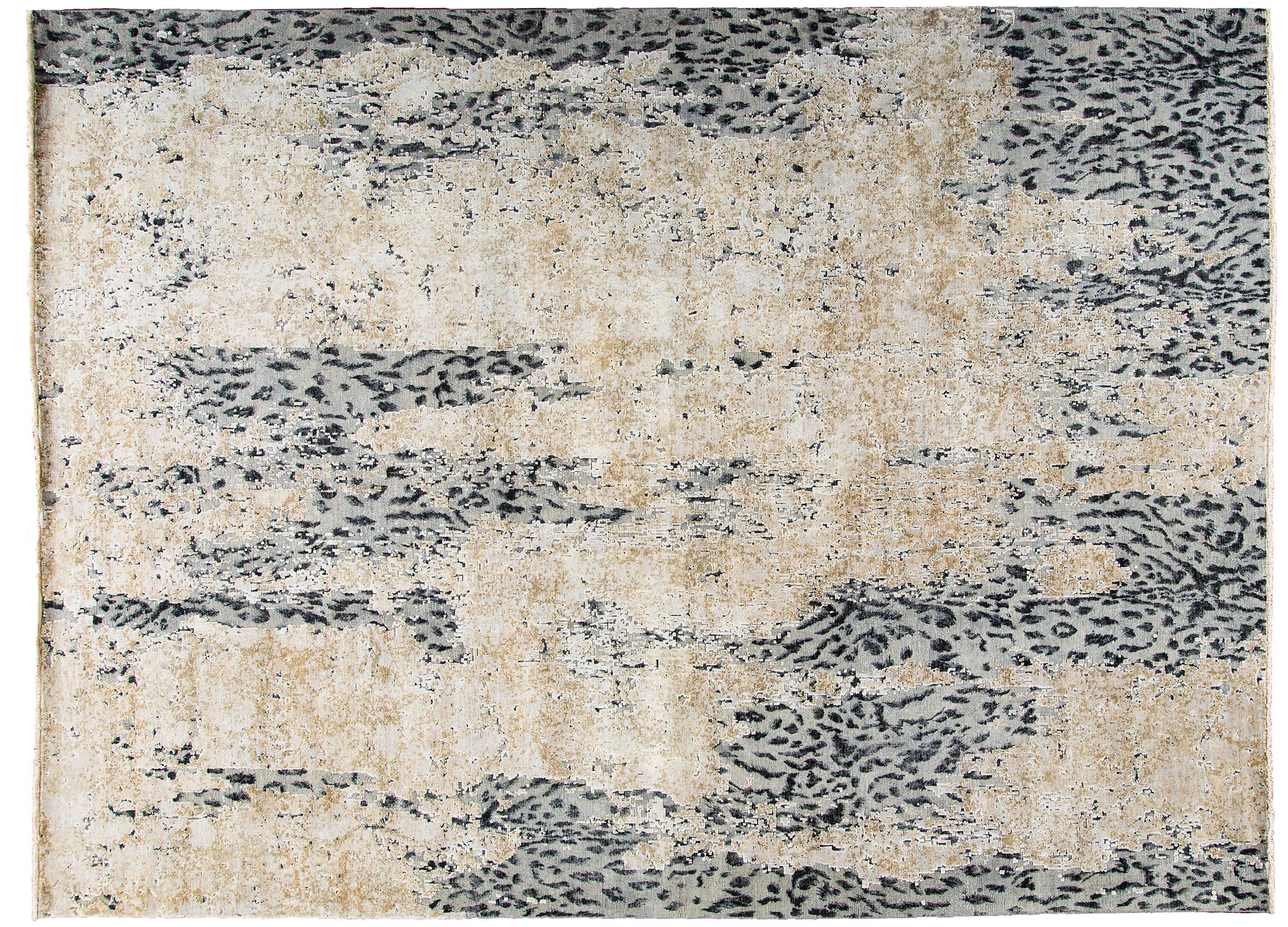 This contemporary leopard wool and silk Indian rug in gray, creme and black transforms this ubiquitous animal motif into couture for your floor. The hand-knotted, leopard patterned wool ground in gray and black, undulates in and out of an overlay of