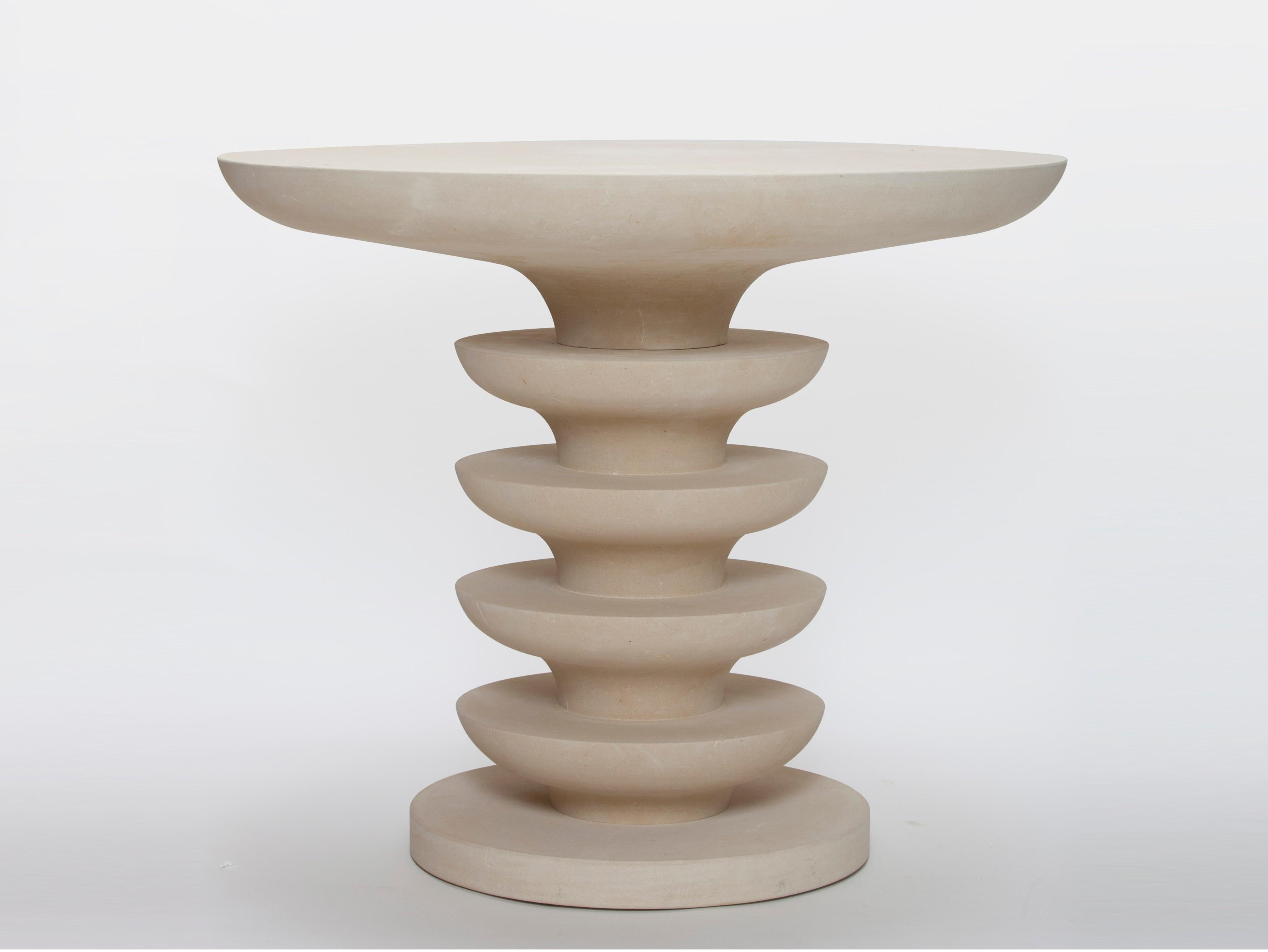 A sculptural beige limestone table suitable for indoor and outdoor settings.
Materials: limestone
Size: 90 cm diameter x 75 cm height
Weight: 250 lbs
Made In Italy.
Please contact us if you have any questions about customization and pricing. We will