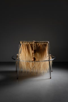 Contemporary limited edition armchair - stainless steel and natural fiber