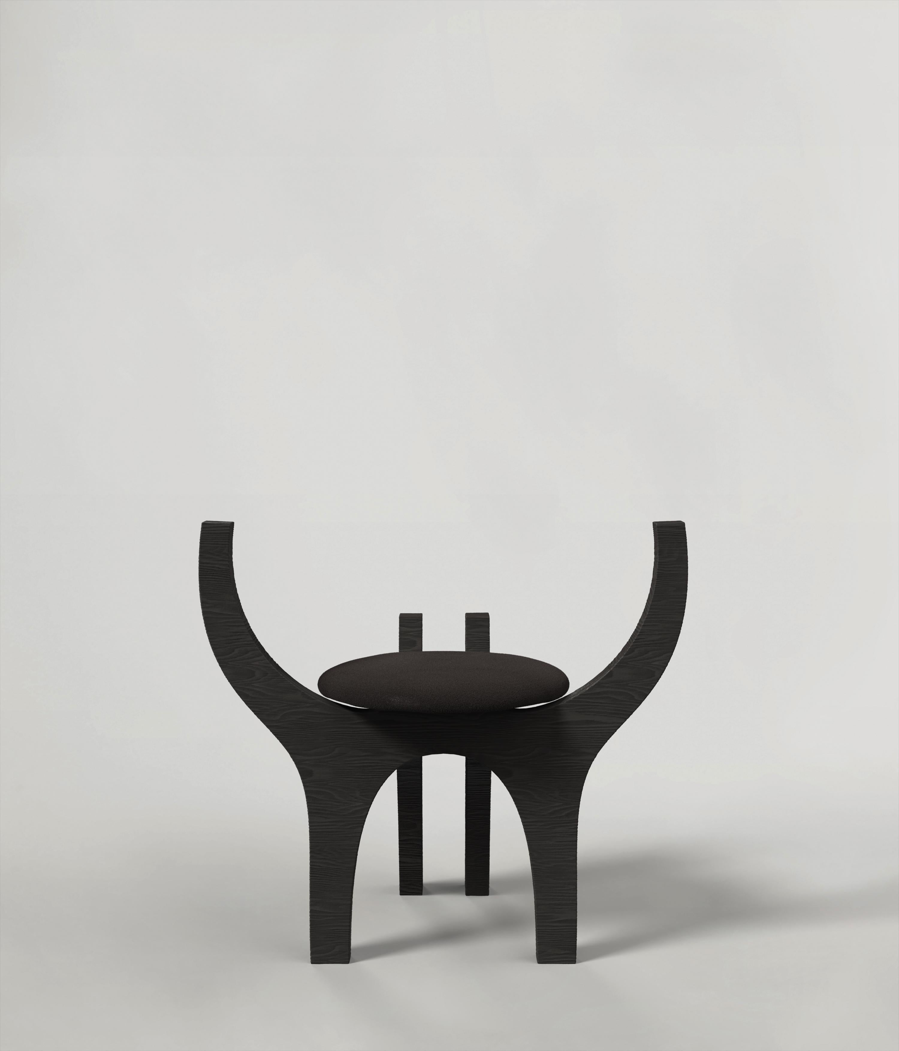 Zero V1 is a 21st century sculptural stool made by young Italian artists in black ebonized ash wood  technique. It is part of the collectible design language Zero that has been developed and authentically signed in Milan. Conceived as an ancestral