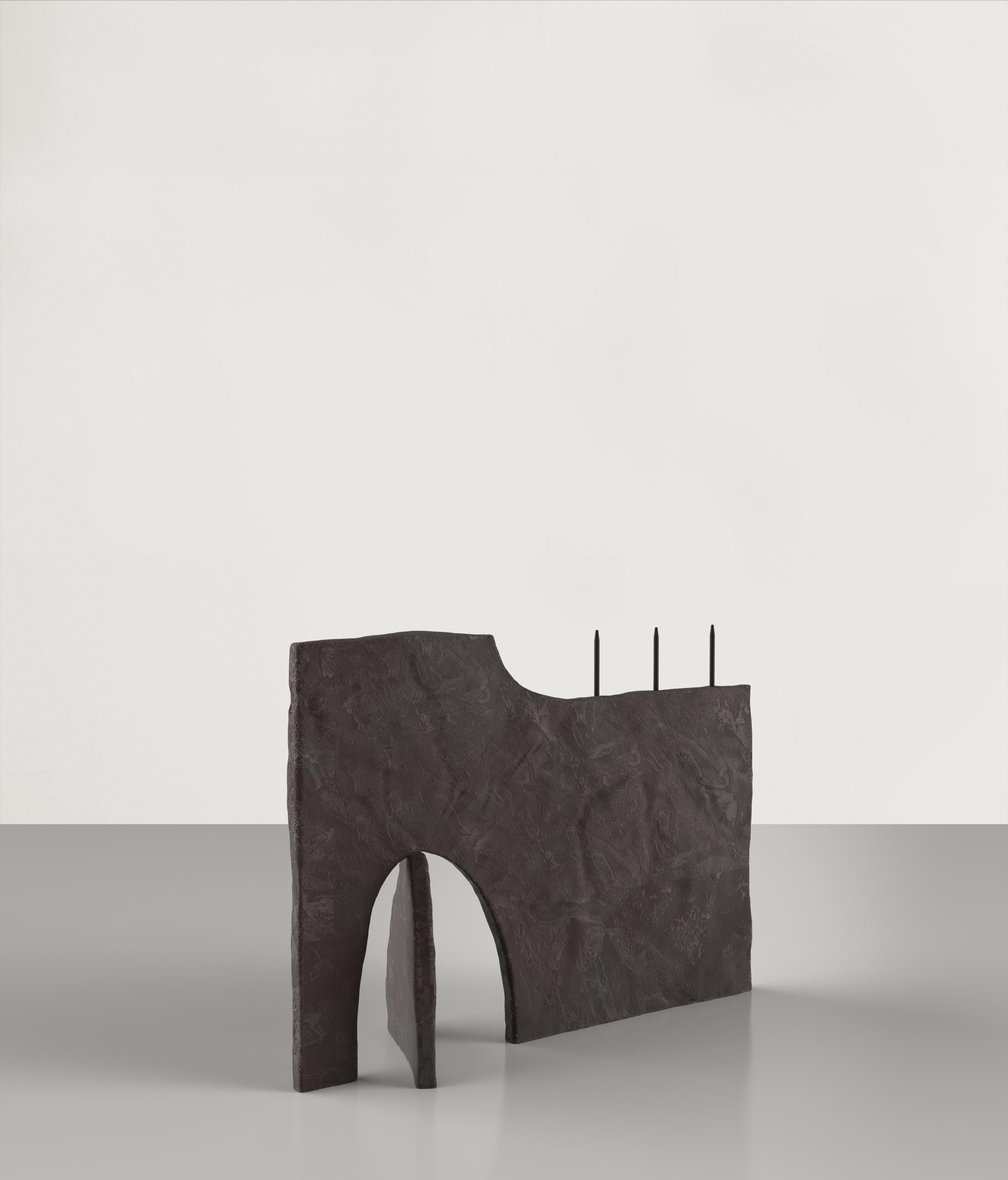 Ouble V1 is a 21st century candle holder made by young Italian artists in a brown bronze patina. It is part of the collectible design language Ouble that has been developed by the Edizione Limitata's art research team in Milan. The exploration that