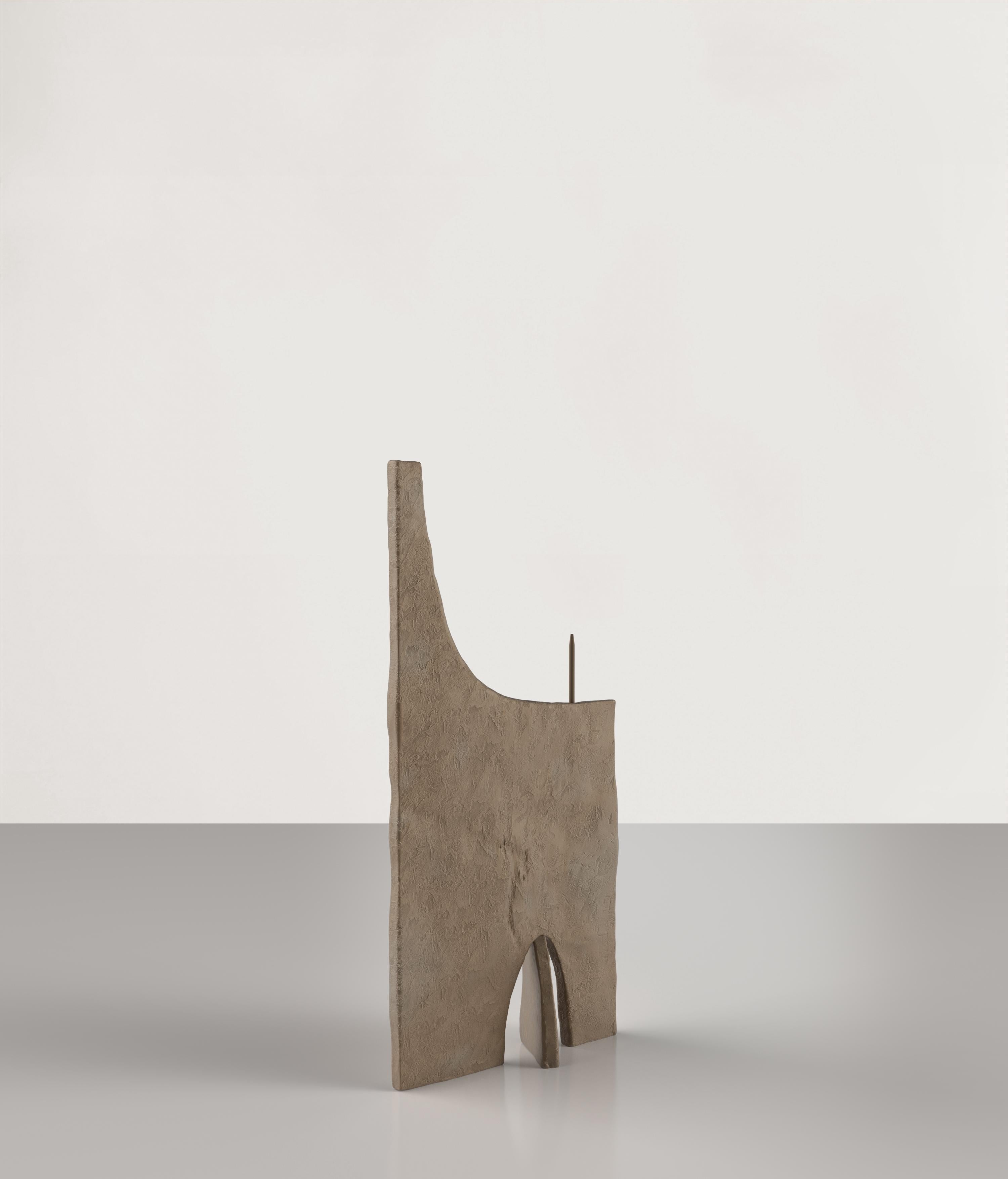 Ouble V2 is a 21st Century candle holder made by young Italian artists in a brown bronze patina. It is part of the collectible design language Ouble that has been developed by the Edizione Limitata's art research team in Milan. The exploration that