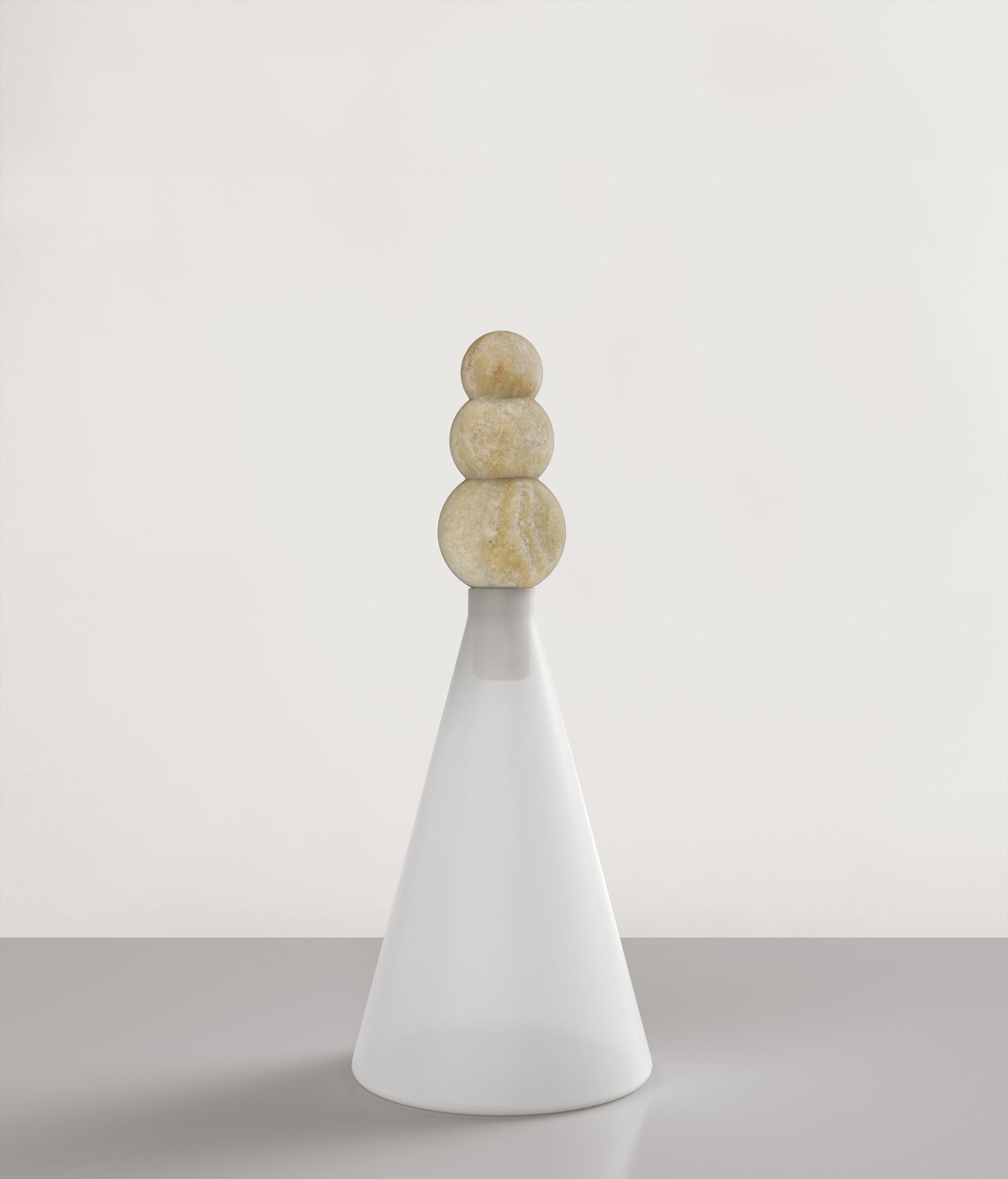 Kite V1 is a 21st Century bottle made by Italian artisans in sanded white glass and miele Onyx. It is part of the collectible design language Kite that has been developed by the Edizione Limitata's art research team in Milan. The top is designed as
