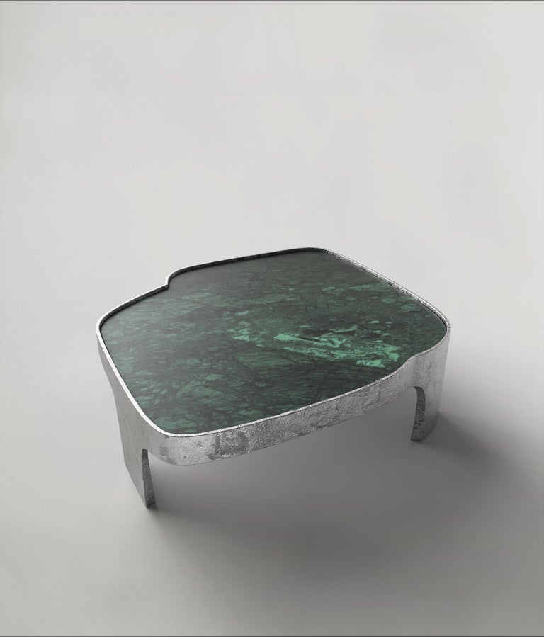 Sumatra V2 is a 21st Century low table made by Italian artisans in aluminium with an extraordinary Verde Guatemala green marble plane. It is part of the collectible design language Sumatra that has been developed by the Edizione Limitata's art