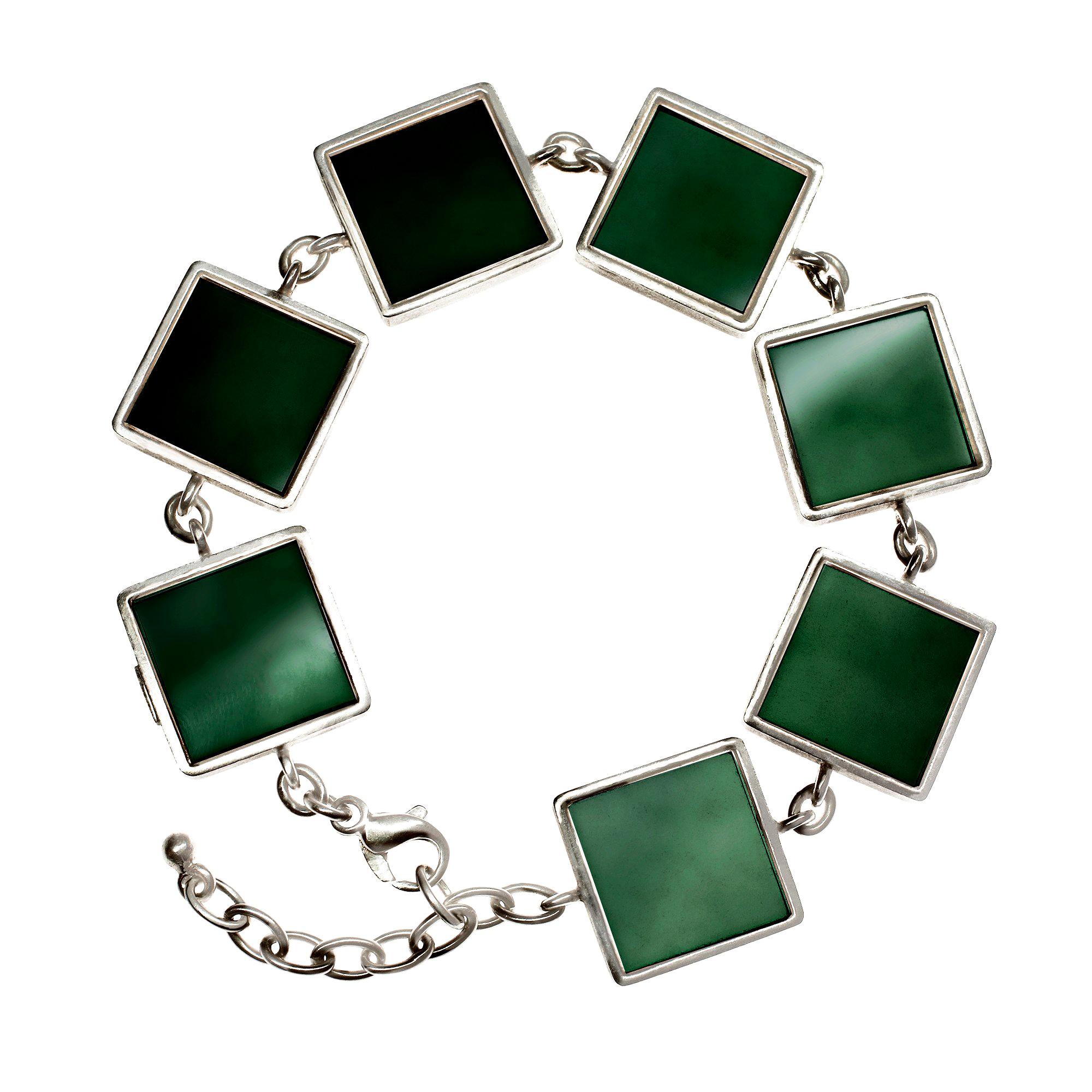 This Art Deco style bracelet is made of sterling silver and features seven dark and vivid green grown quartzes, each measuring 15x15x3 mm. It was featured in Harper's Bazaar UA and Vogue UA.

The bracelet is an eye-catching piece of jewelry that has