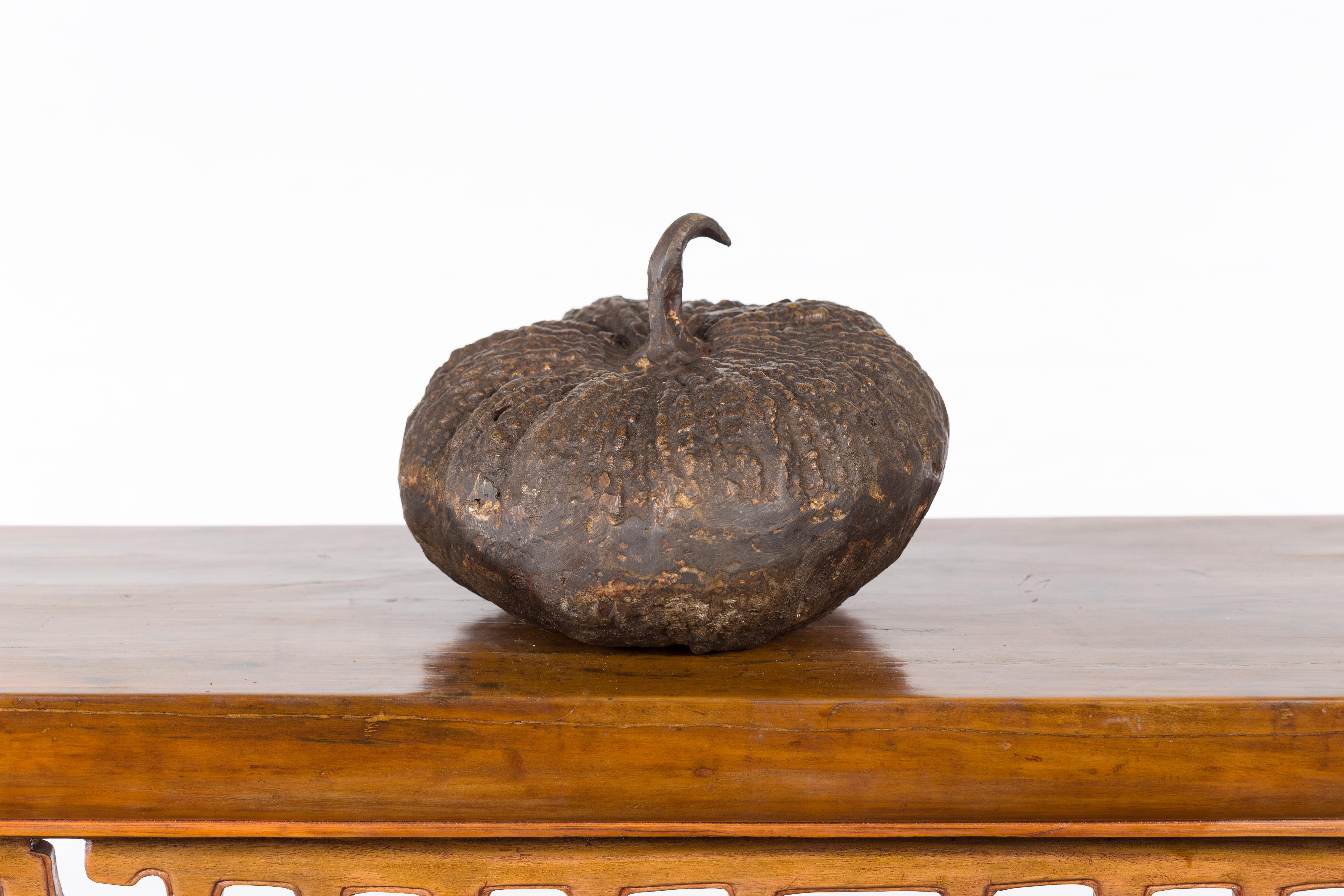 A contemporary lost wax bronze pumpkin sculpture with rustic patina. We have several available, priced and sold $350 each. Created with the traditional technique of the lost-wax (à la cire perdue) which allows for great precision and finesse in the