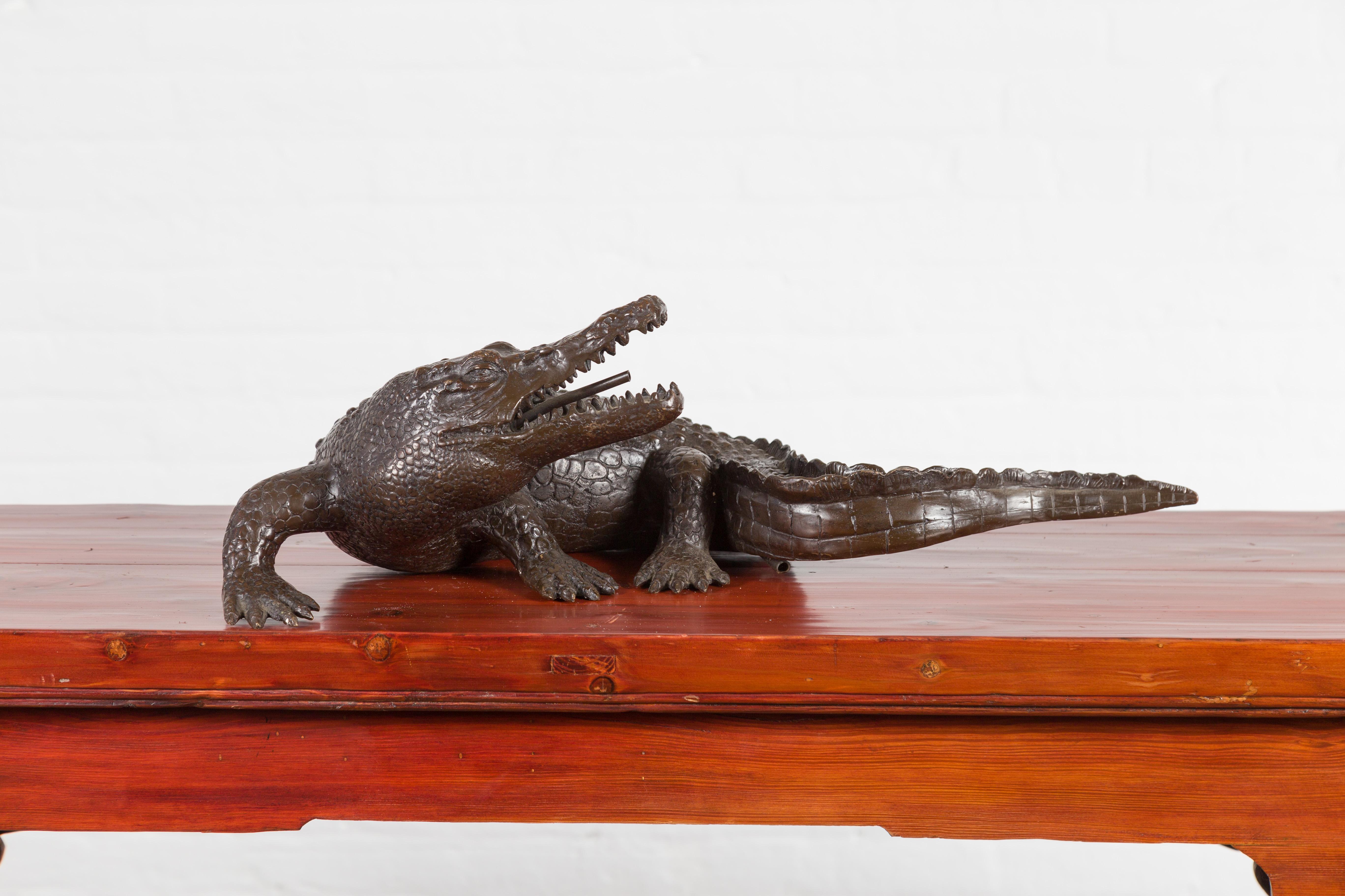 A contemporary lost wax cast bronze alligator sculpture with textured skin. Created with the traditional technique of the lost-wax (à la cire Perdue) that allows a great precision in the details, this bronze sculpture features a striking alligator.
